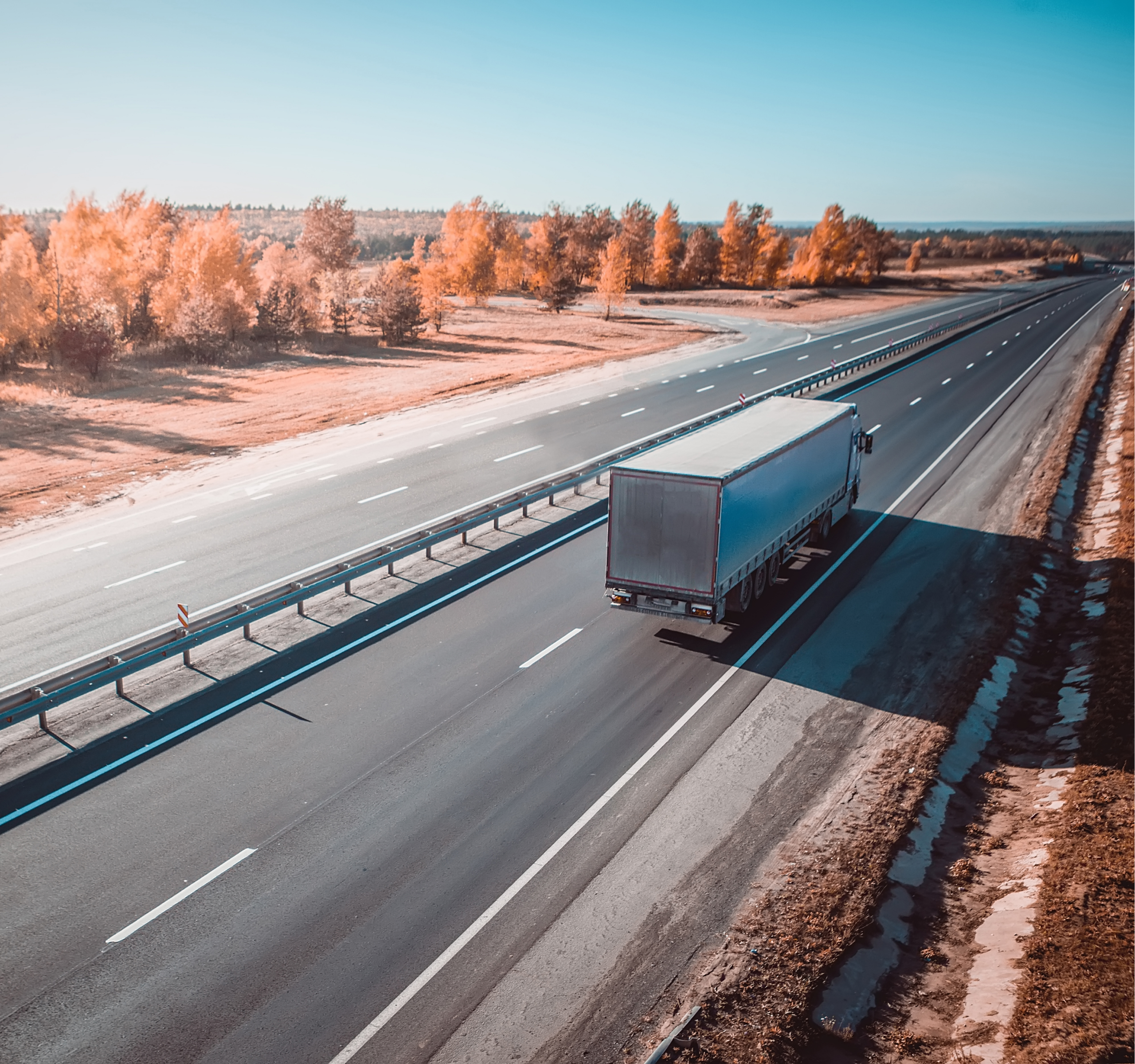 Freight truck driving down highway