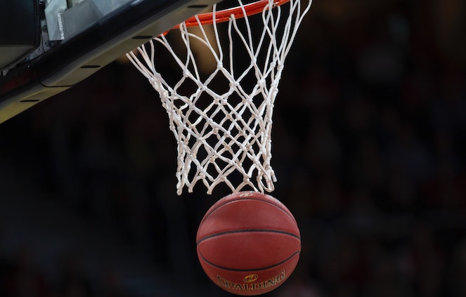Basketball falling through net during a game