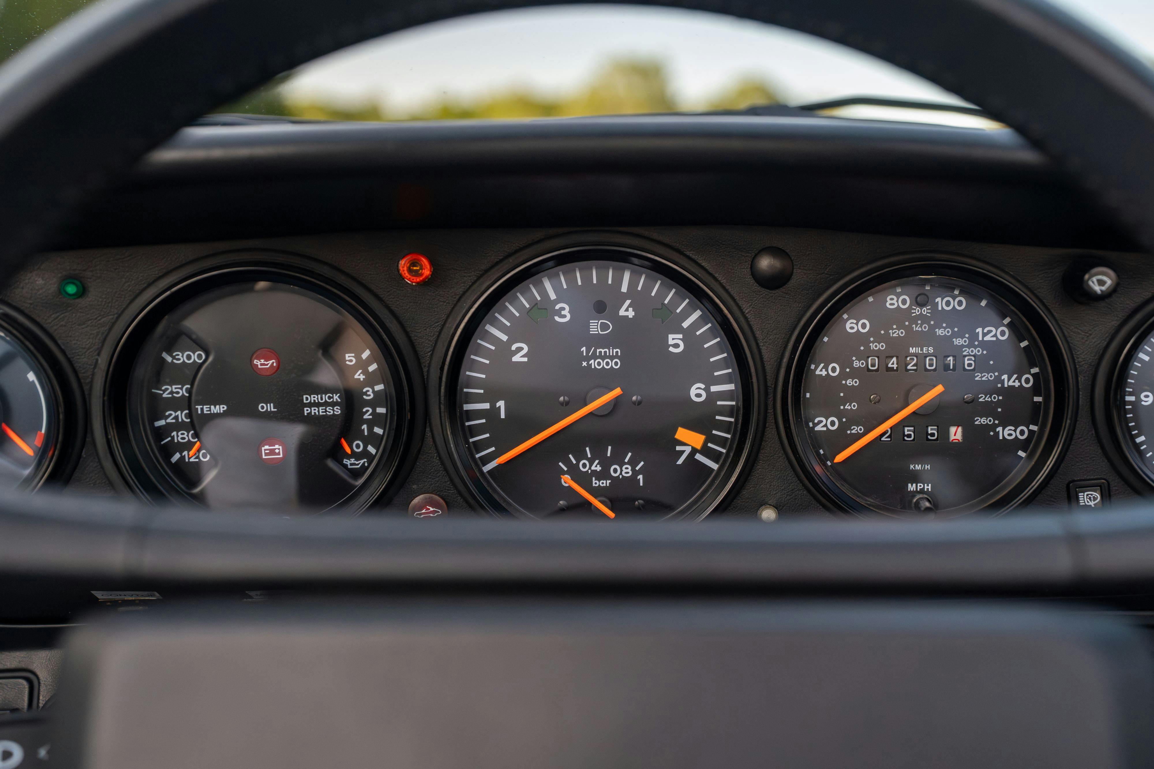 1986 Porsche 930 Turbo gauge cluster in White on Black with the factory slatenose M505 option.