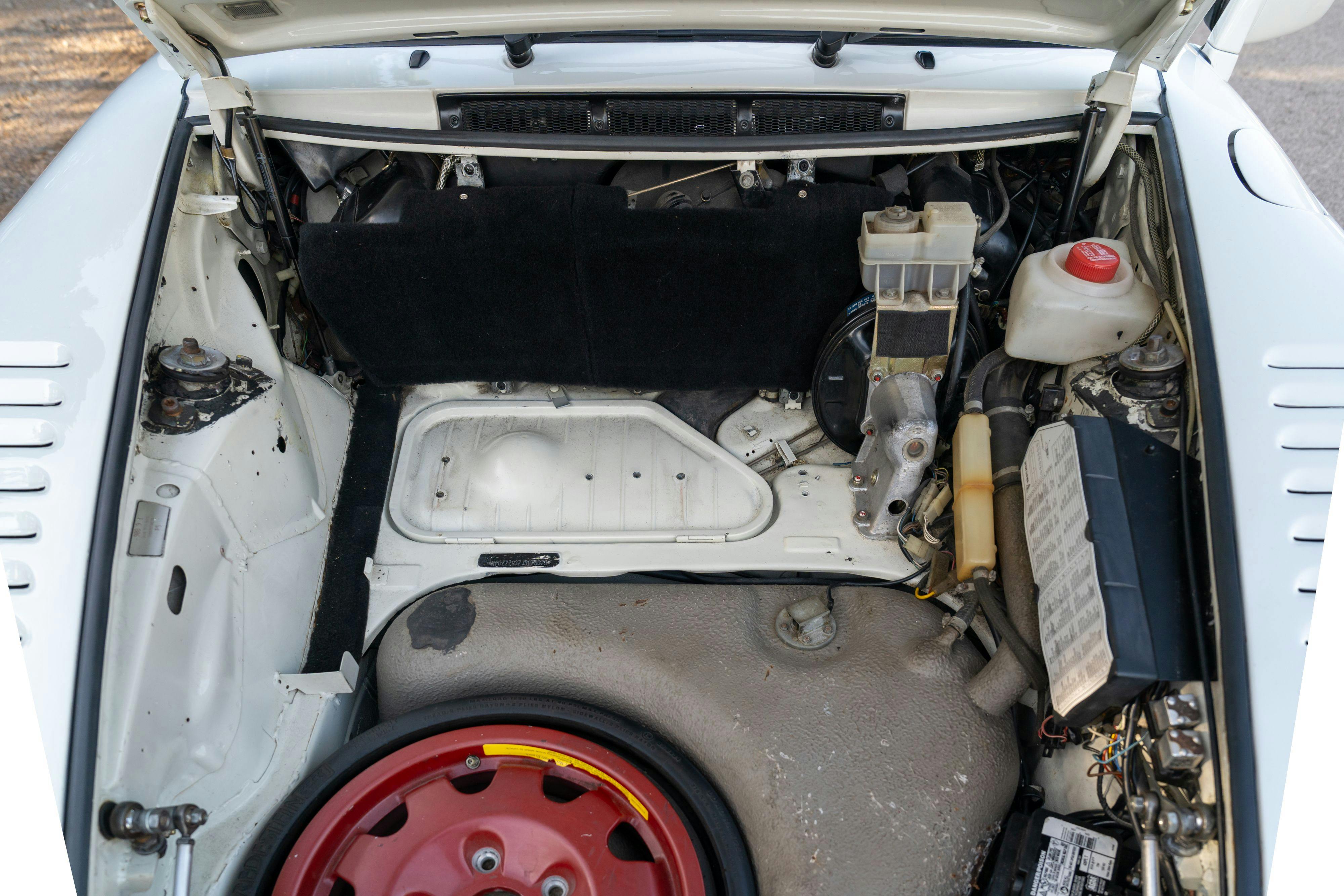 1986 Porsche 930 Turbo engine bay in White on Black with the factory slatenose M505 option.