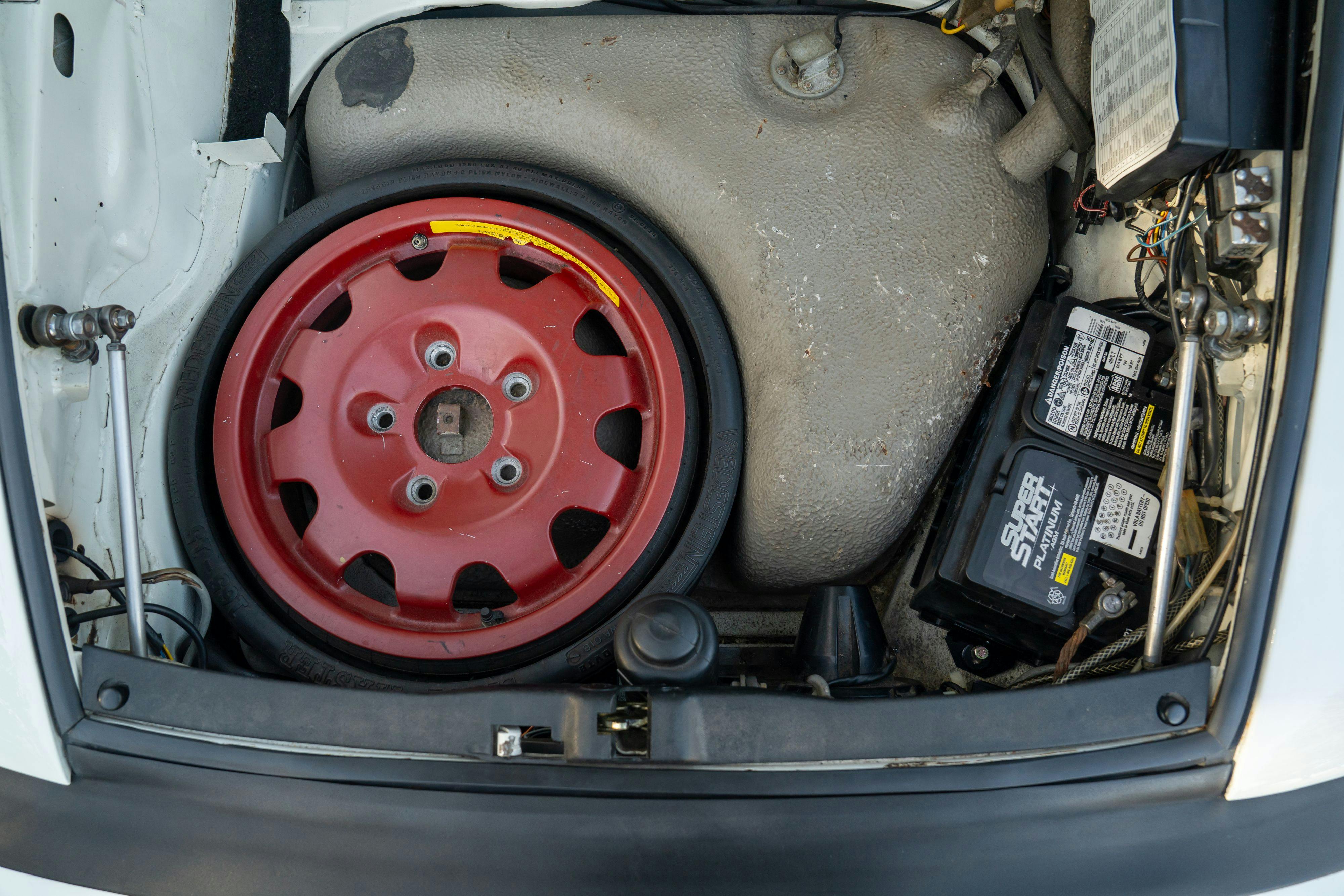 1986 Porsche 930 Turbo engine bay in White on Black with the factory slatenose M505 option.
