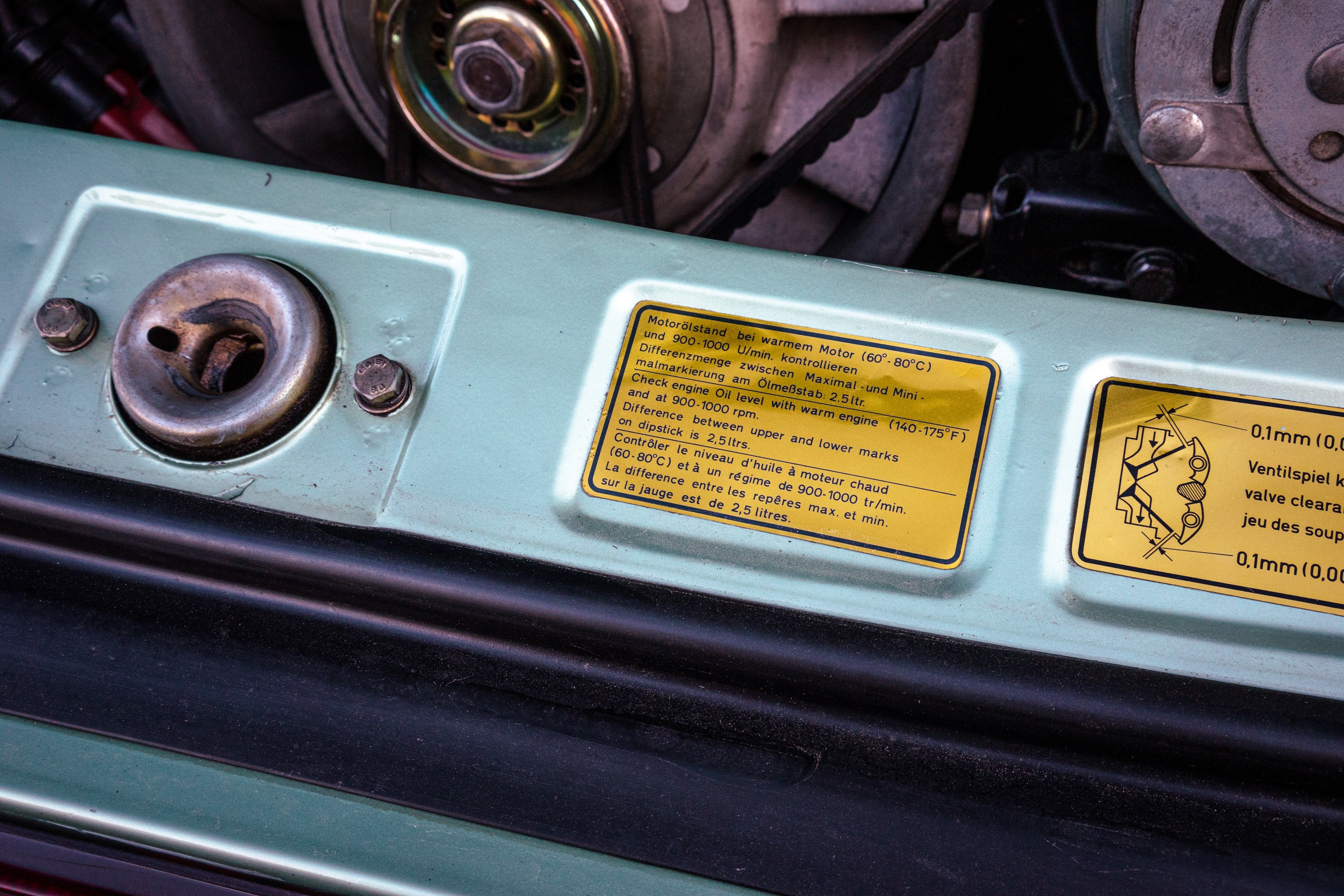 Engine oil sticker on a 930 Turbo in Ice Metallic Green.