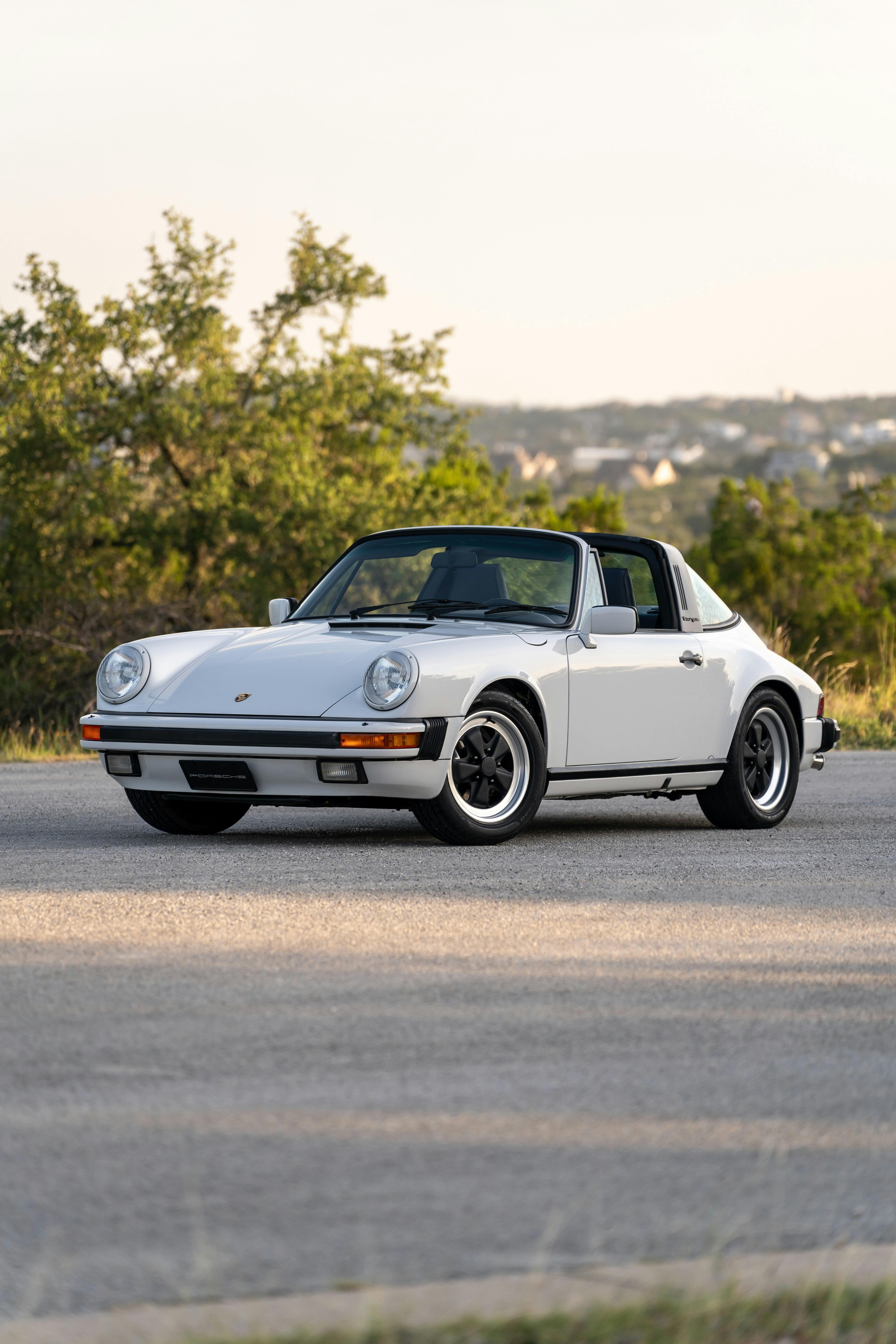 Marble Grey 1986 Porsche 911 Carrera Targa with blue interior shot in Austin, TX.