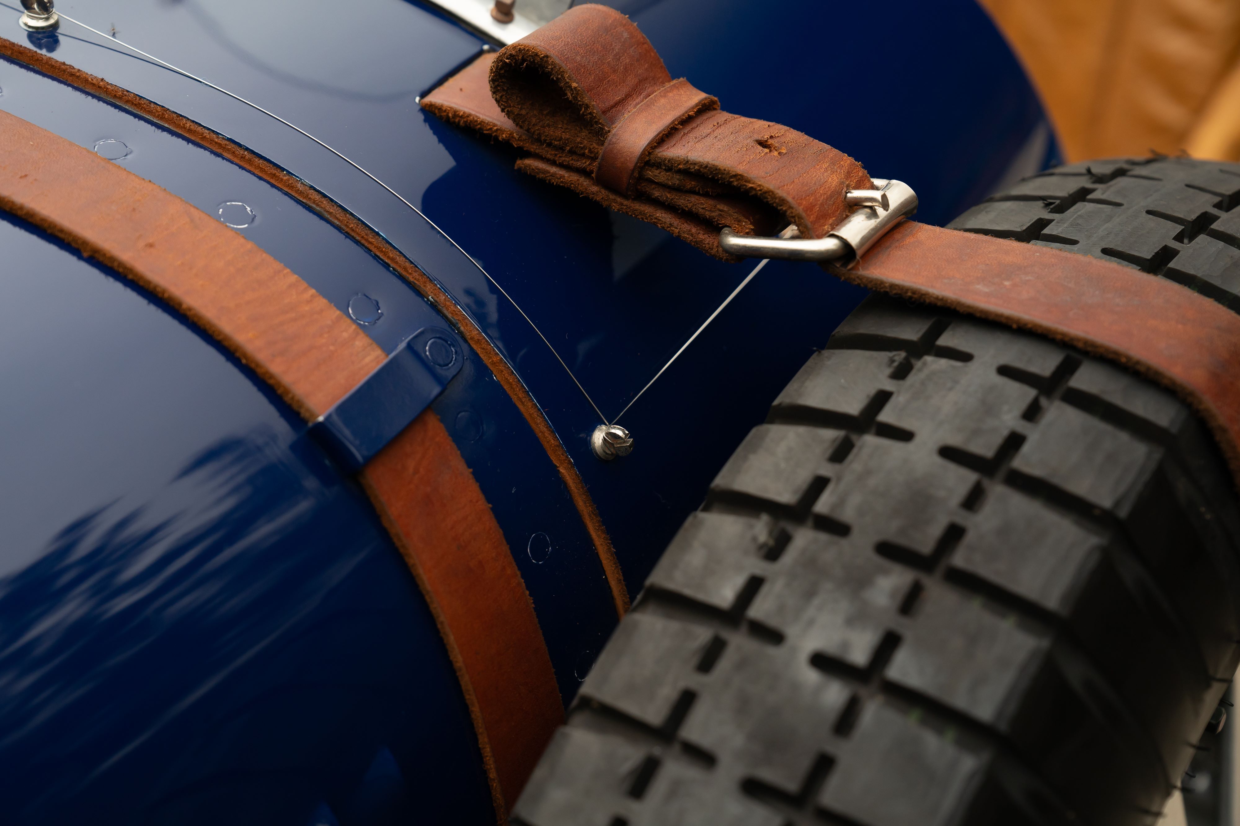 Spare tire on a Pur Sang Bugatti Type 35 in Blue over Brown shot in Austin, TX.