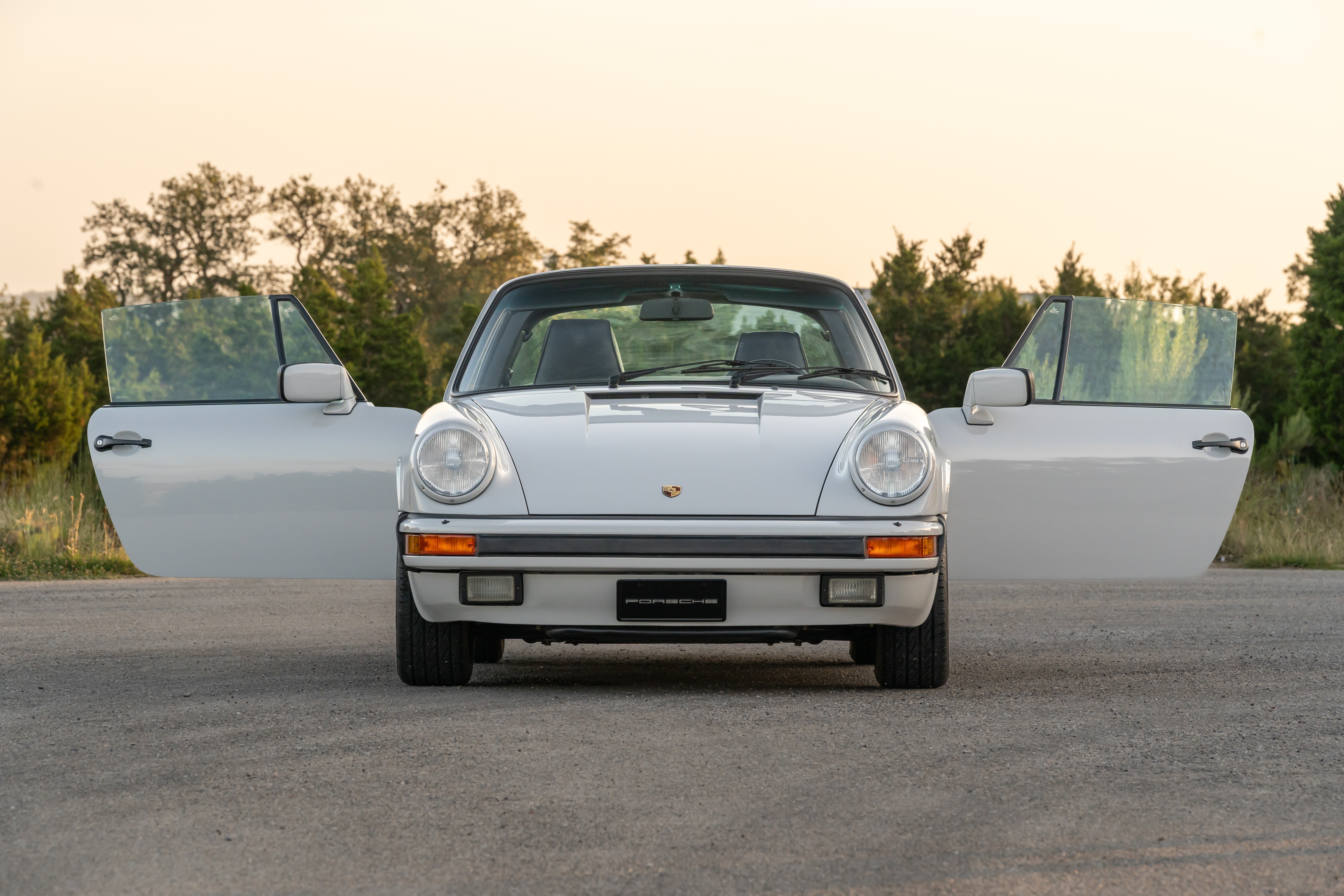 Marble Grey 1986 Porsche 911 Carrera Targa with blue interior shot in Austin, TX.