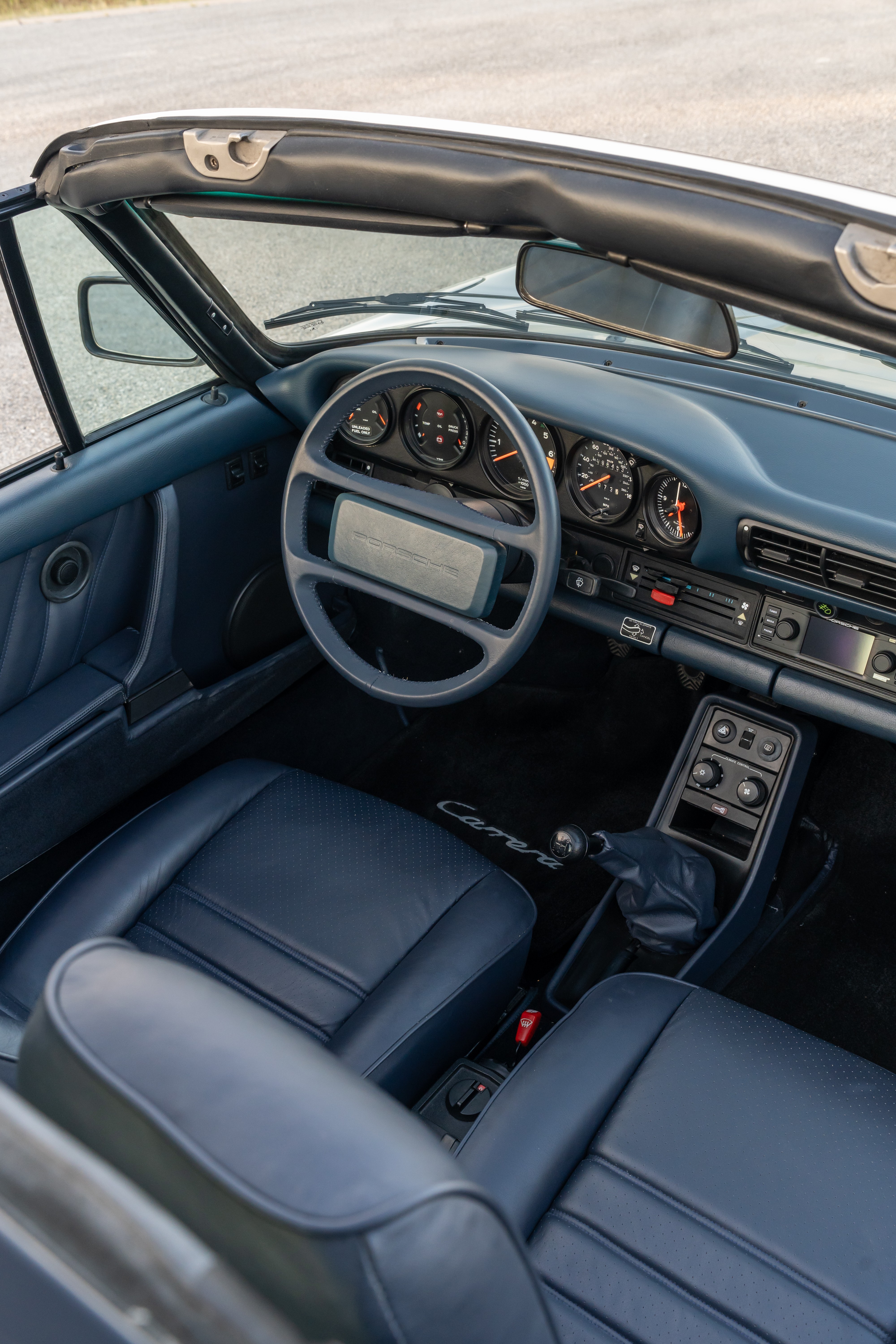 Marble Grey 1986 Porsche 911 Carrera Targa with blue interior shot in Austin, TX.