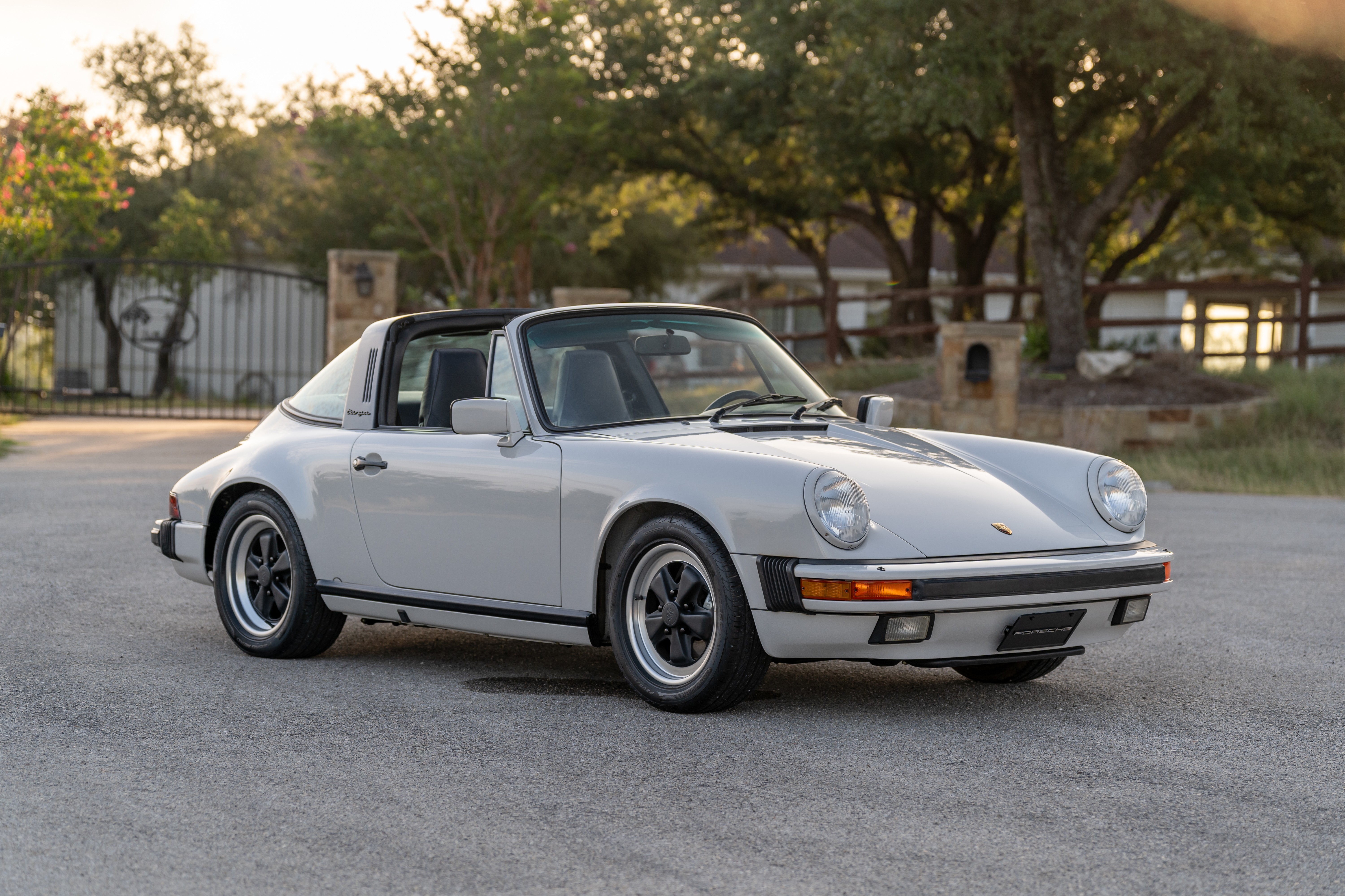 Gauge cluster in a Marble Grey 1986 Porsche 911 Carrera Targa with blue interior shot in Austin, TX.