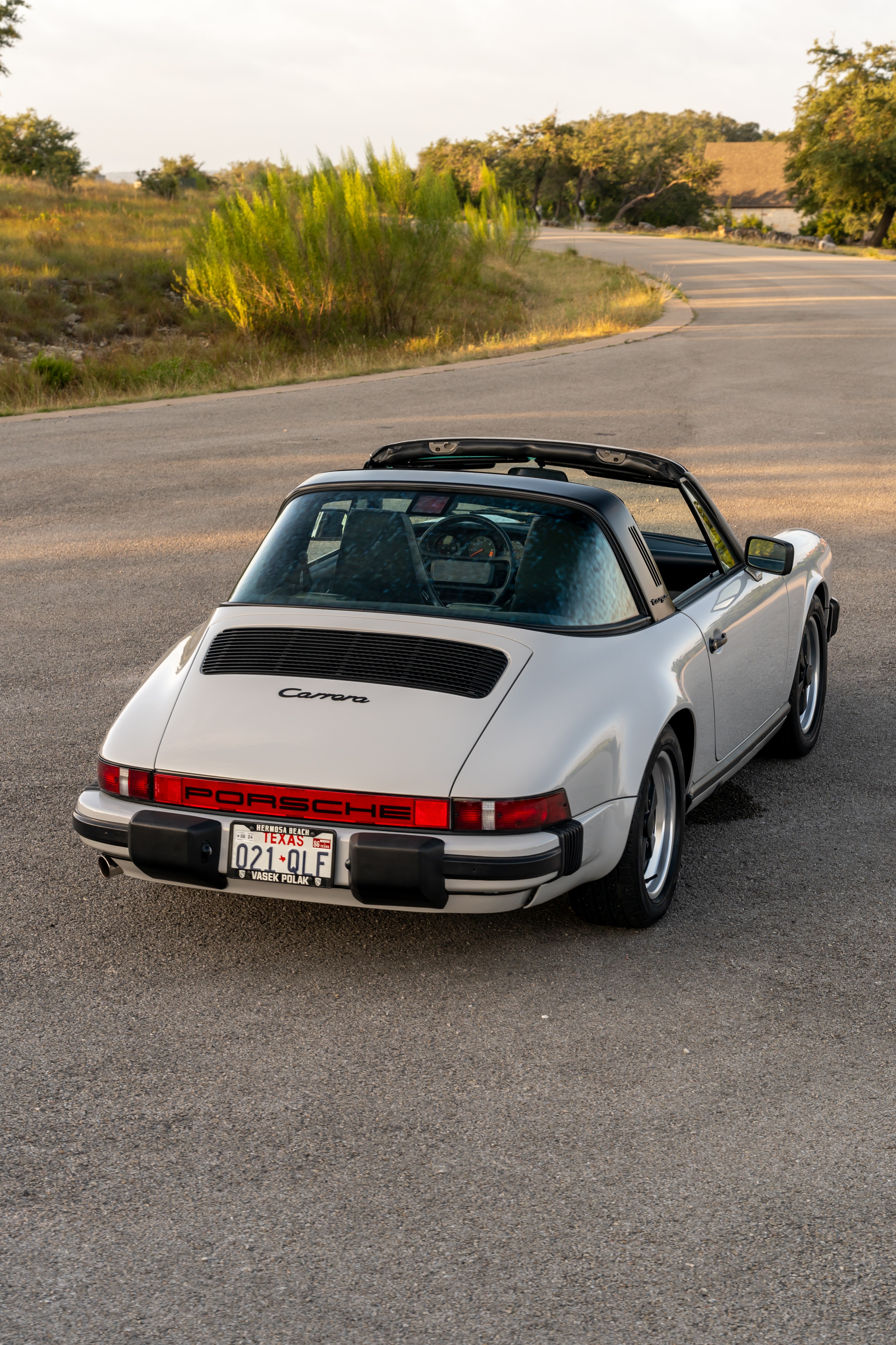 Marble Grey 1986 Porsche 911 Carrera Targa with blue interior shot in Austin, TX.