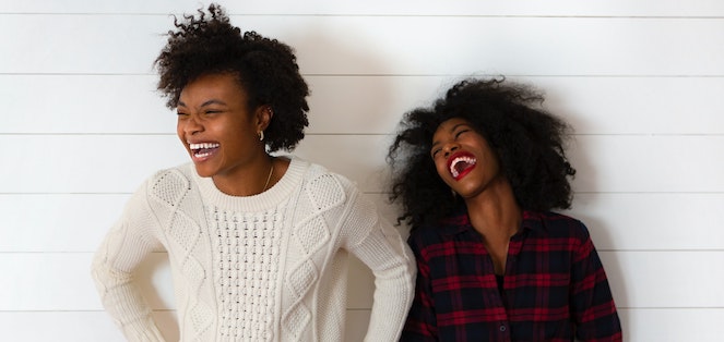 Two women laughing together