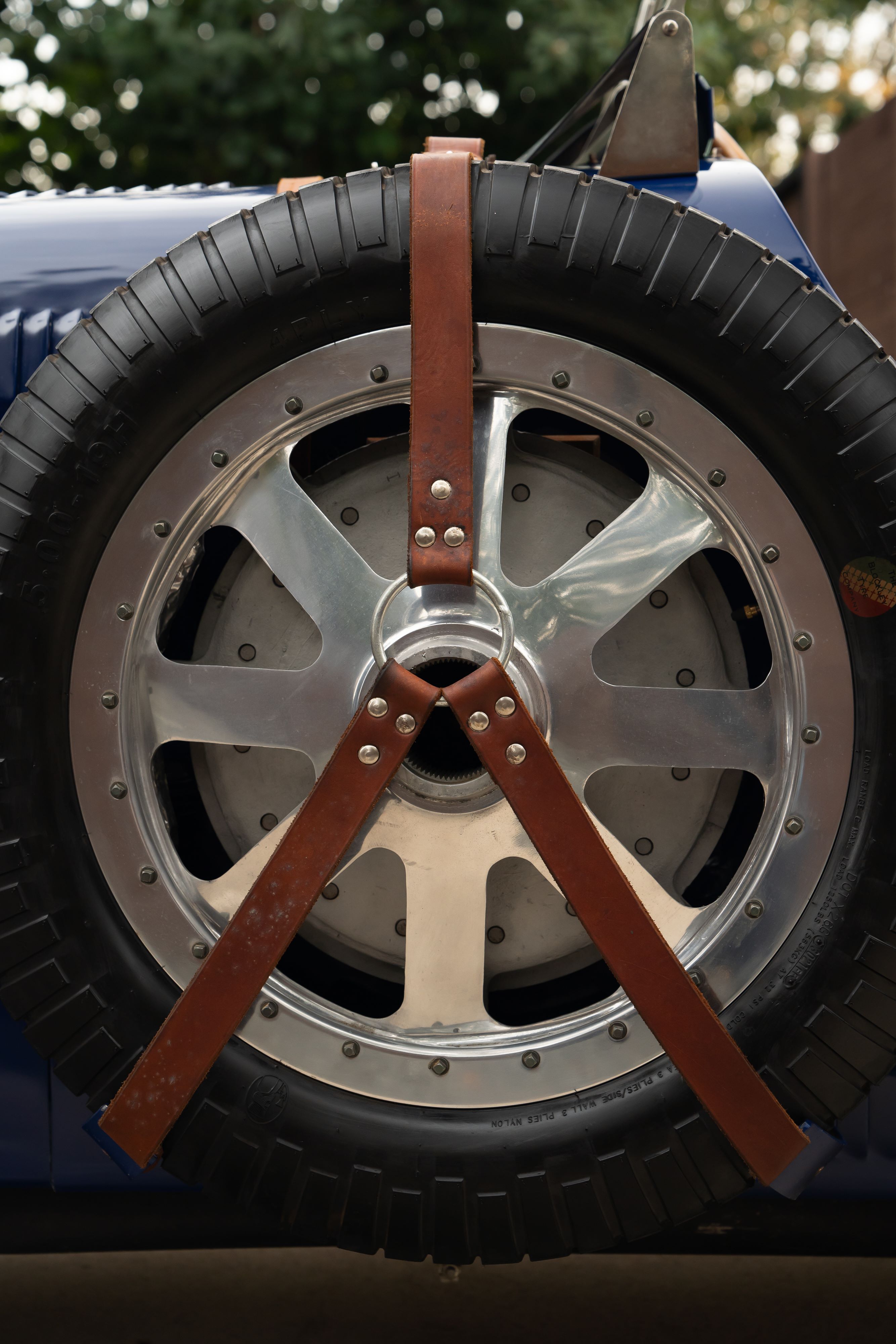 Spare tire on a Pur Sang Bugatti Type 35 in Blue over Brown shot in Austin, TX.