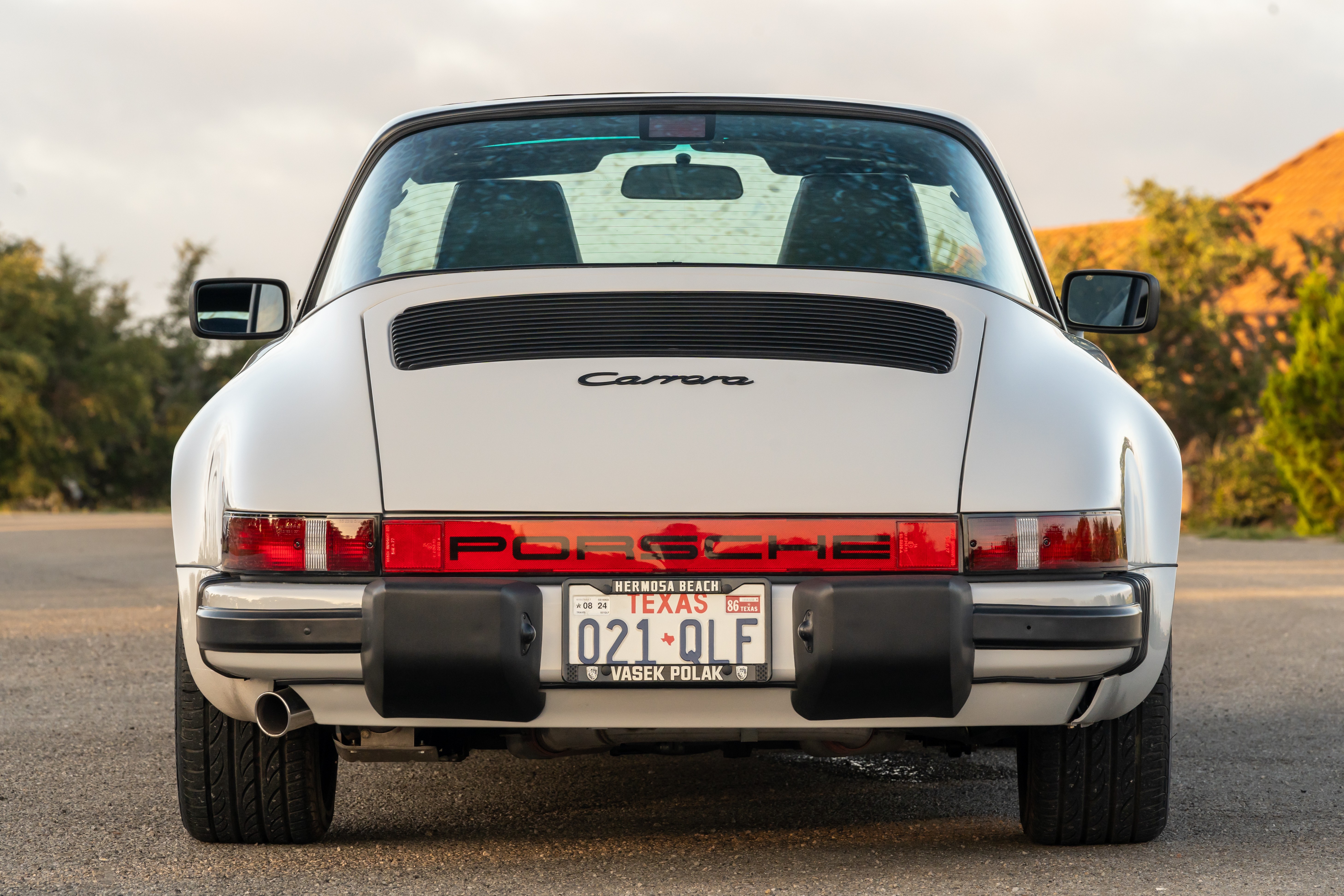 Marble Grey 1986 Porsche 911 Carrera Targa with blue interior shot in Austin, TX.