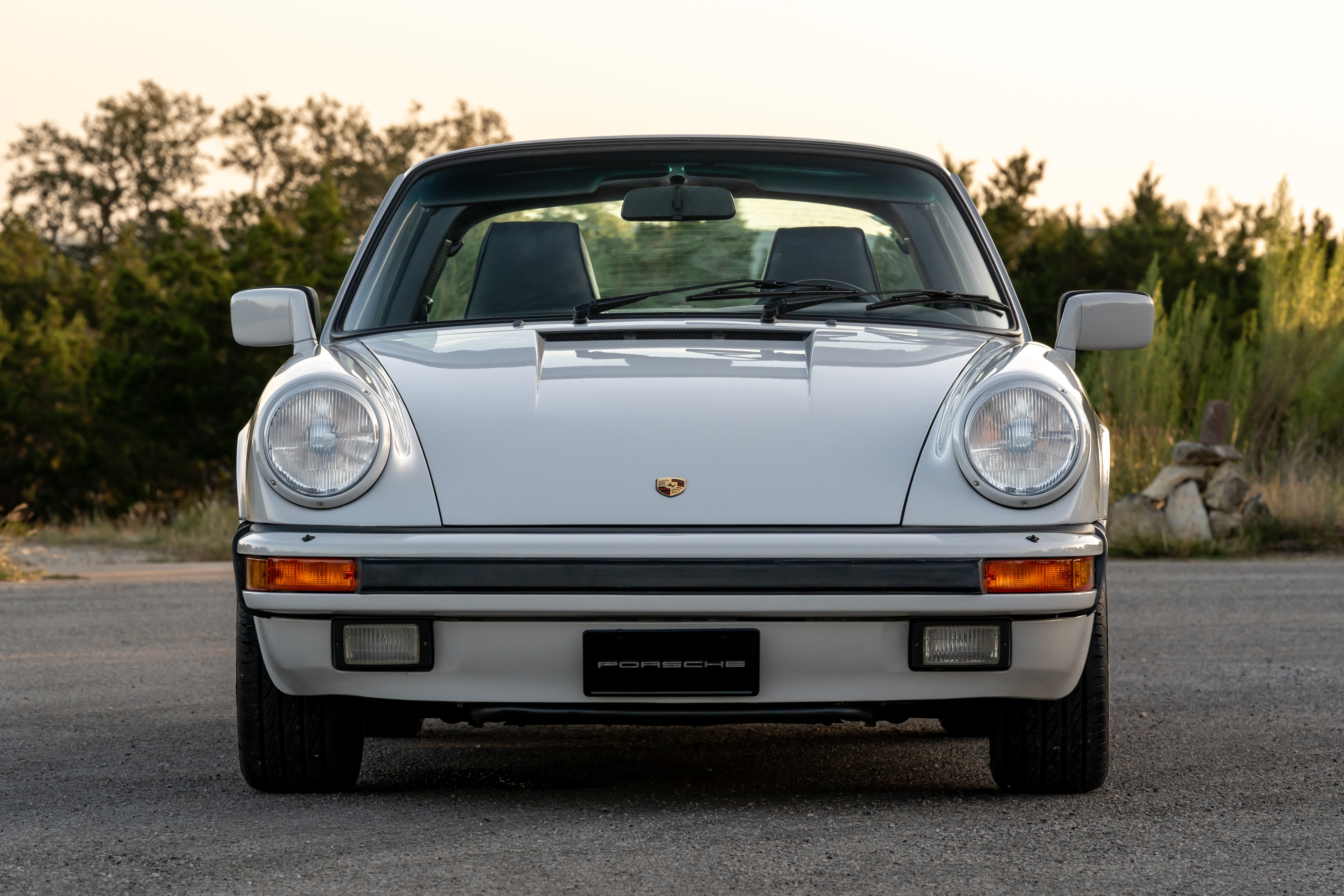 Marble Grey 1986 Porsche 911 Carrera Targa with blue interior shot in Austin, TX.