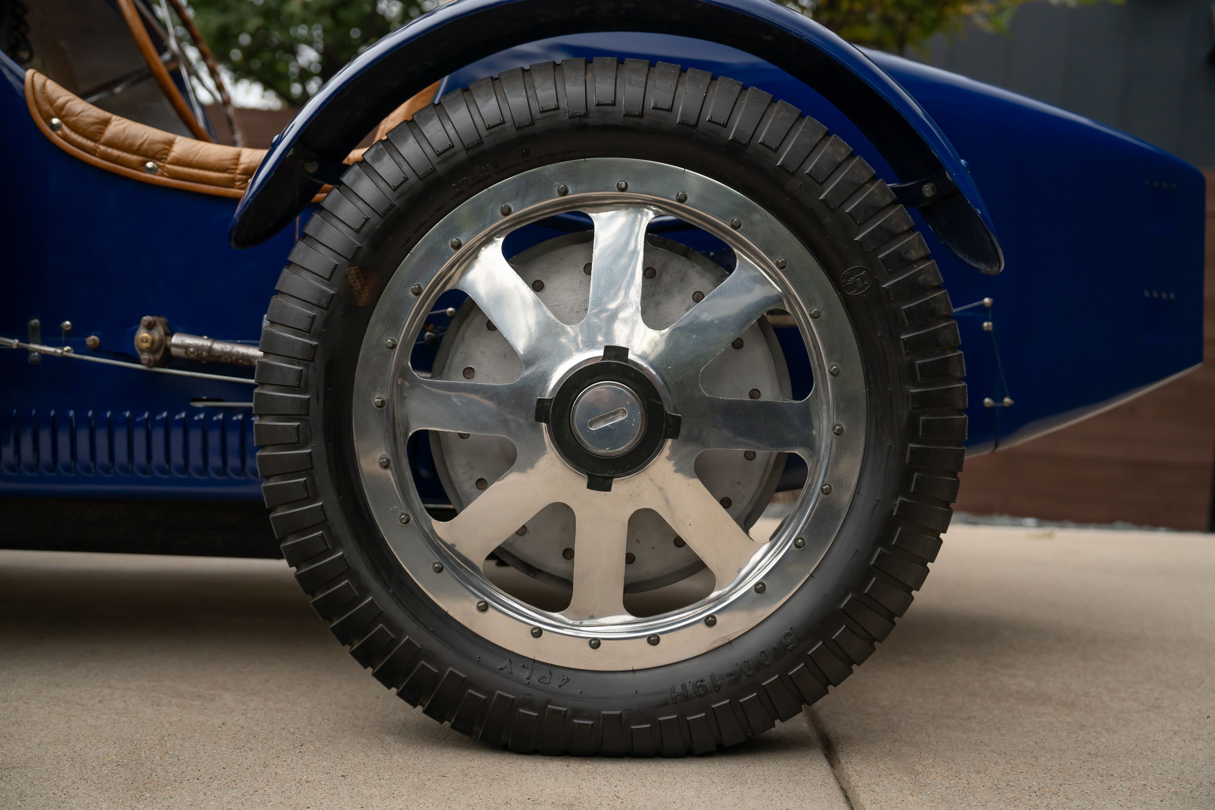 Polished wheels on a Pur Sang Bugatti Type 35 in Blue over Brown shot in Austin, TX.