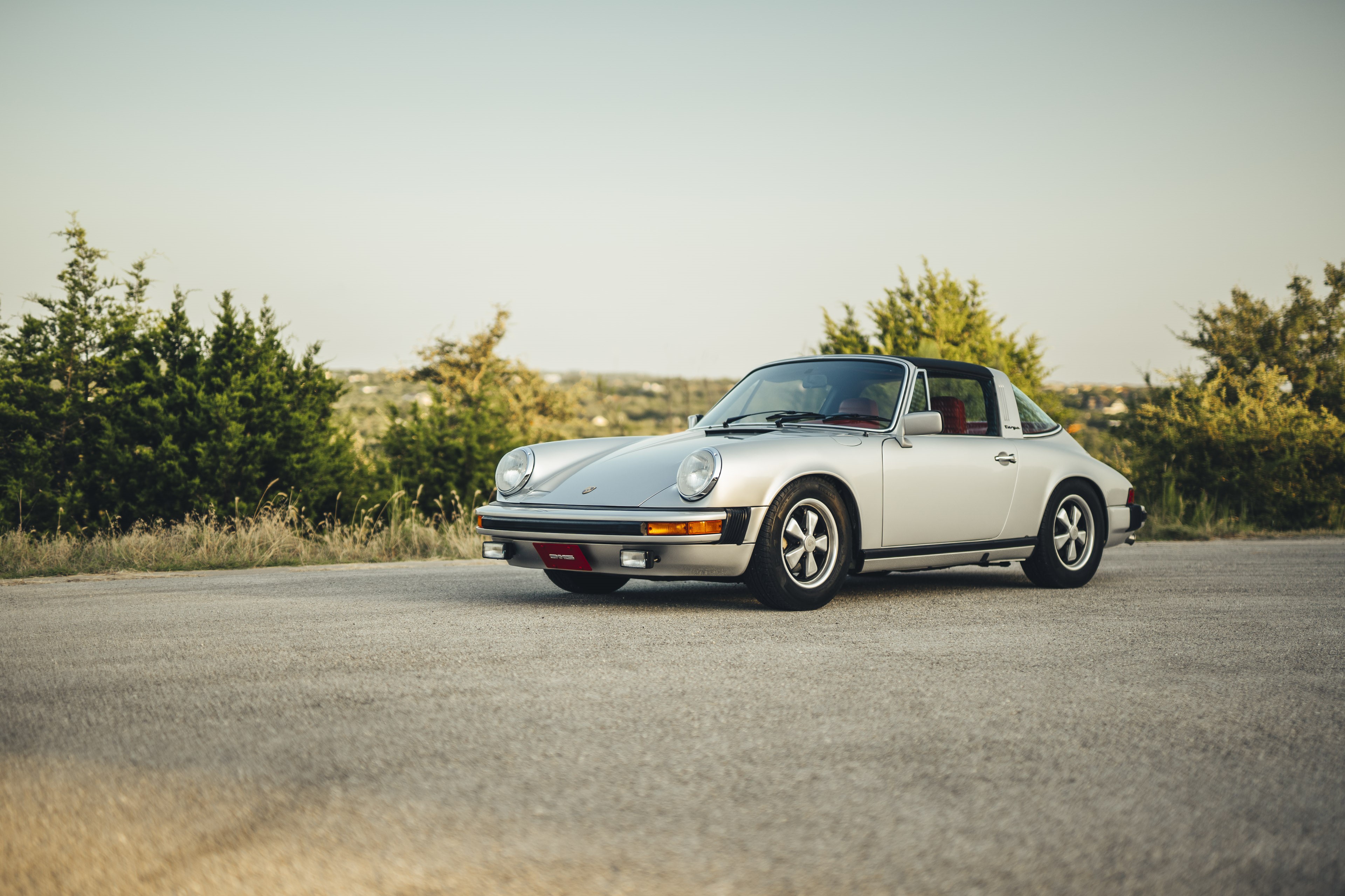 Silver on red Porsche 911S.