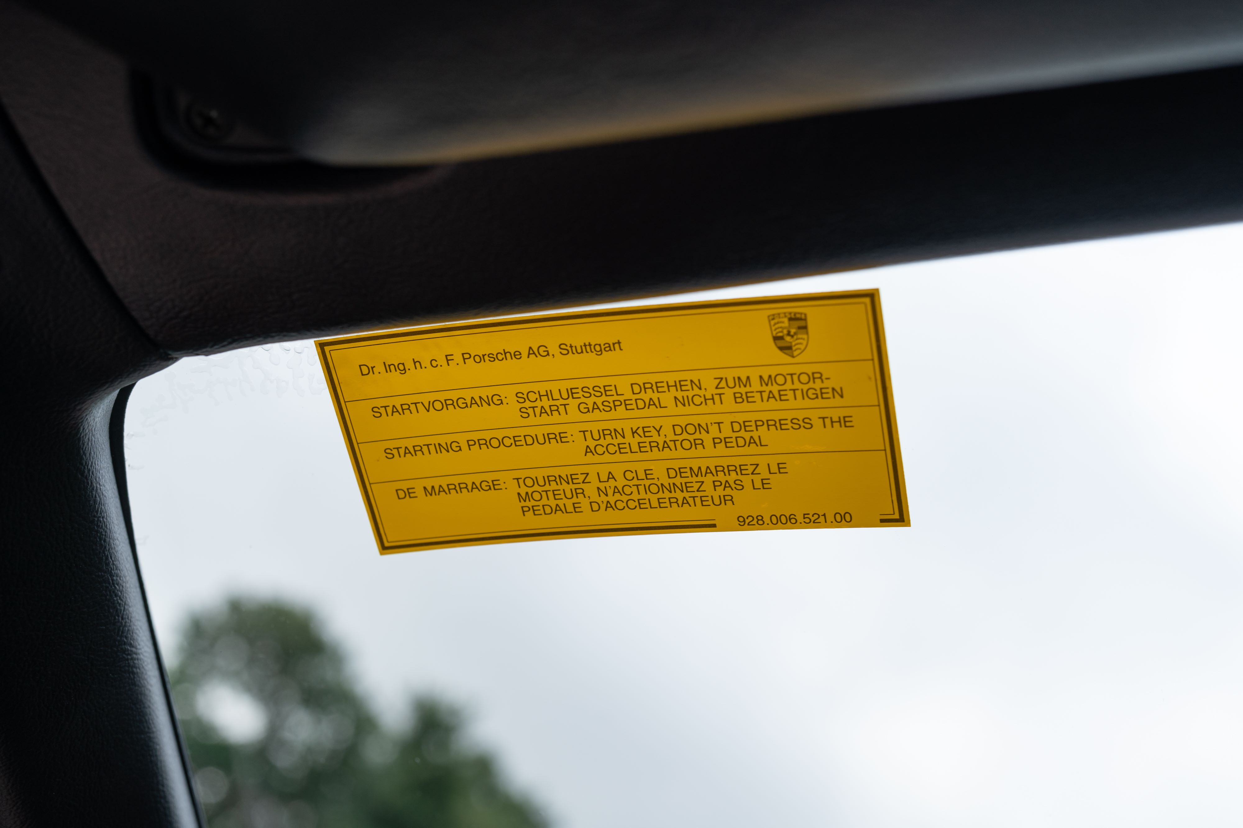 Windshield sticker on a Guards Red Porsche 924 Turbo in Dripping Springs, TX.