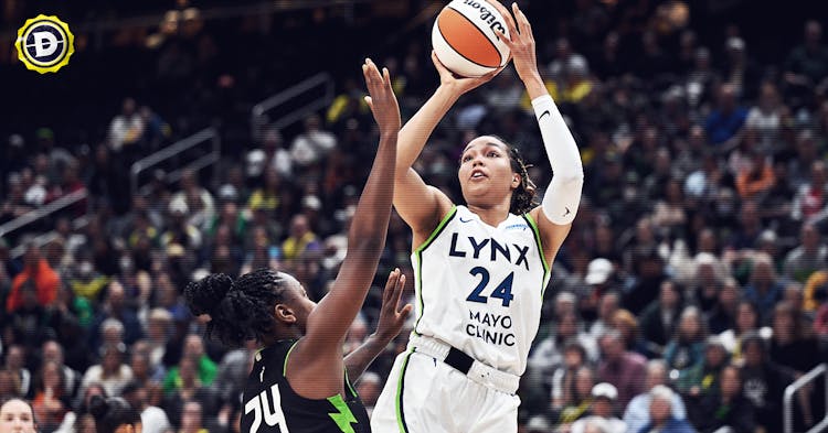 Napheesa Collier shooting over Jewell Loyd.