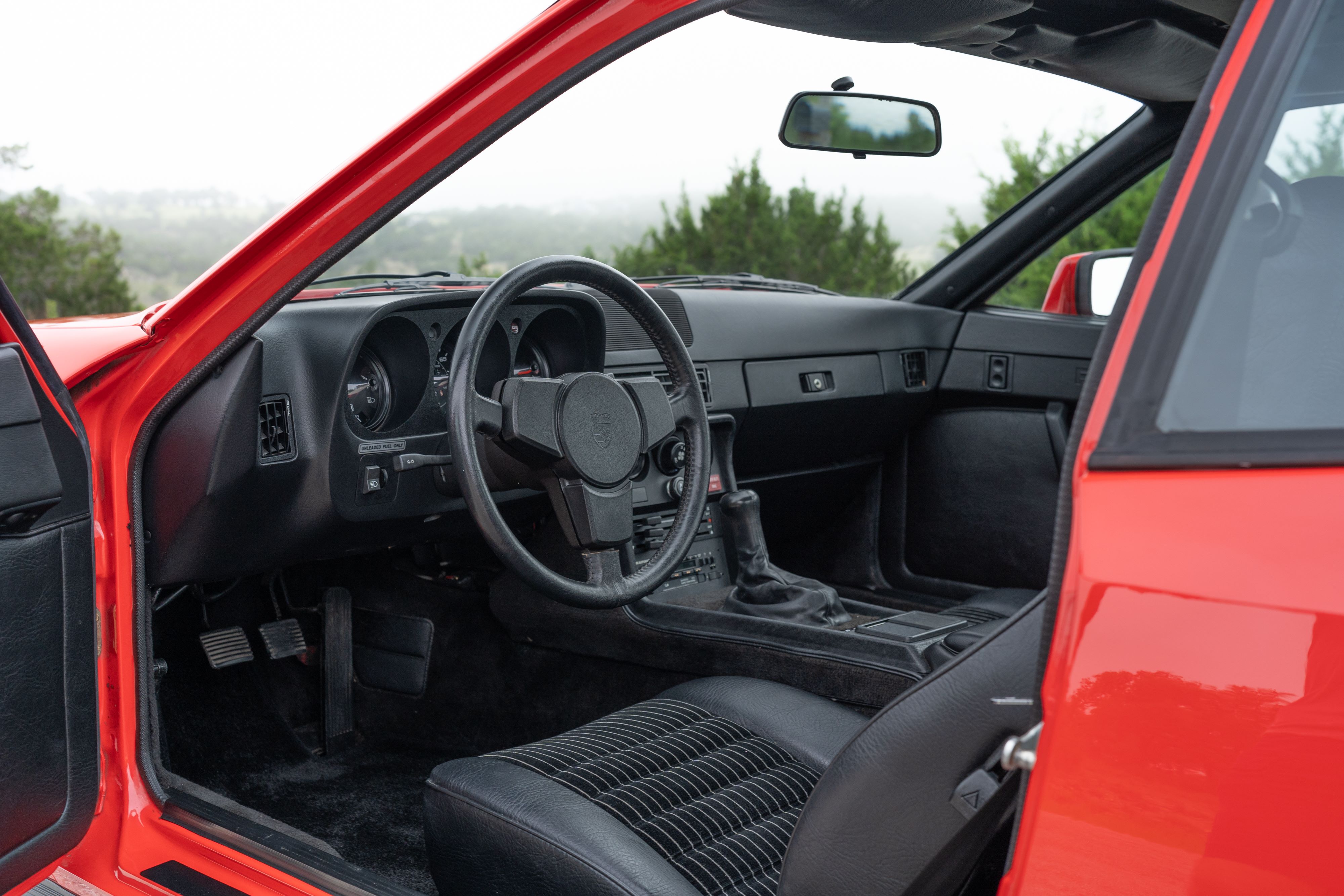 Interior of a Guards Red Porsche 924 Turbo in Dripping Springs, TX.