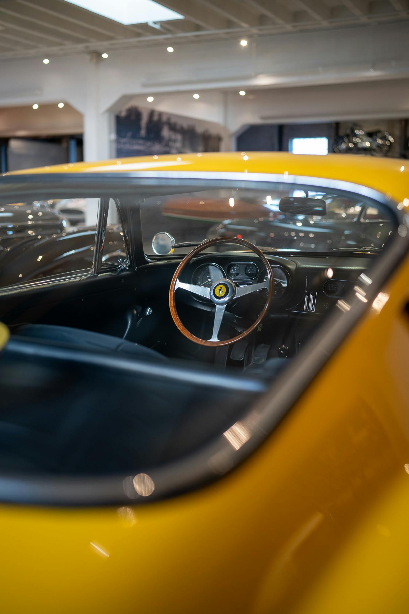 The interior of a yellow Ferrari 275 GTB owned by Bruce Meyer