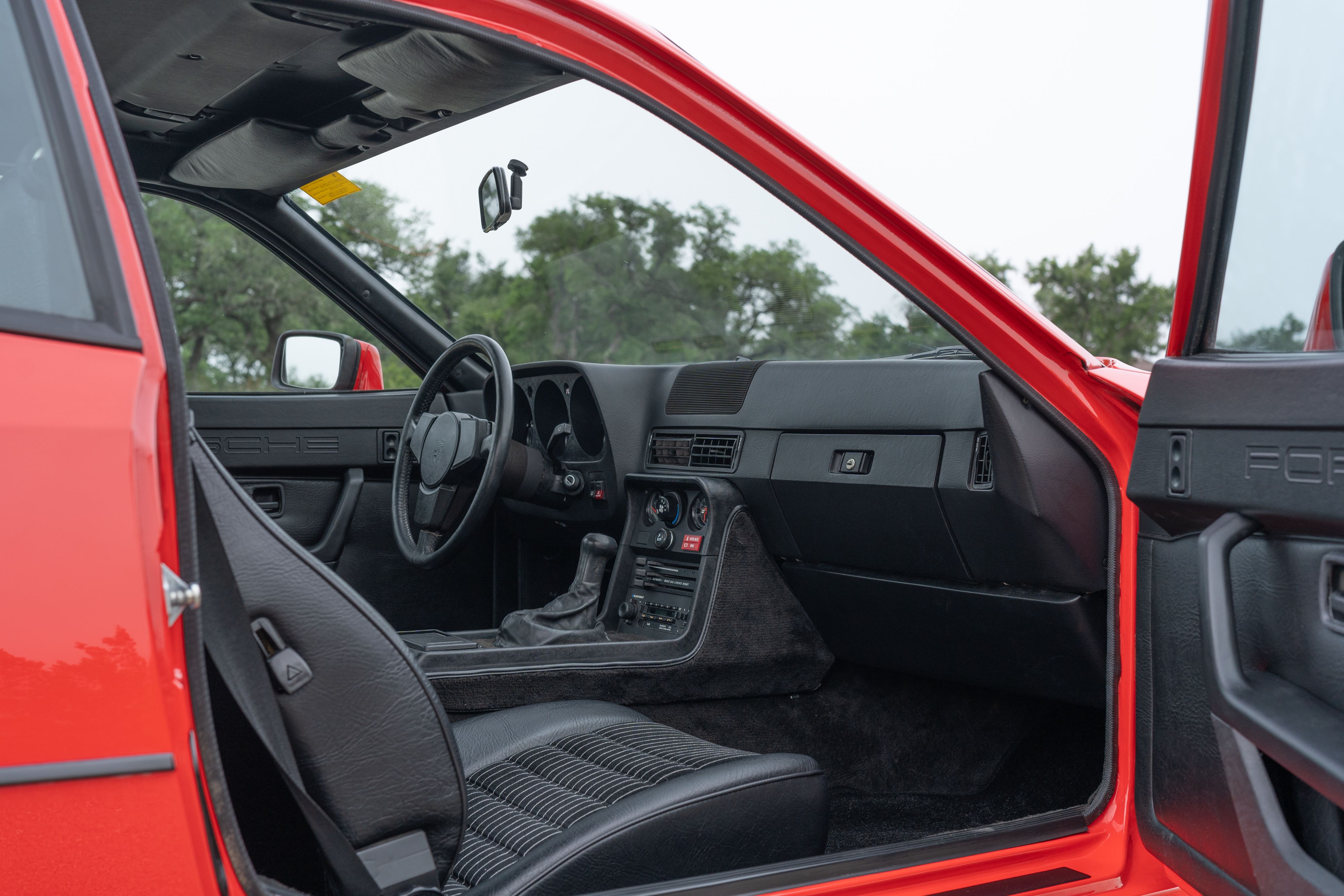 Interior of a Guards Red Porsche 924 Turbo in Dripping Springs, TX.