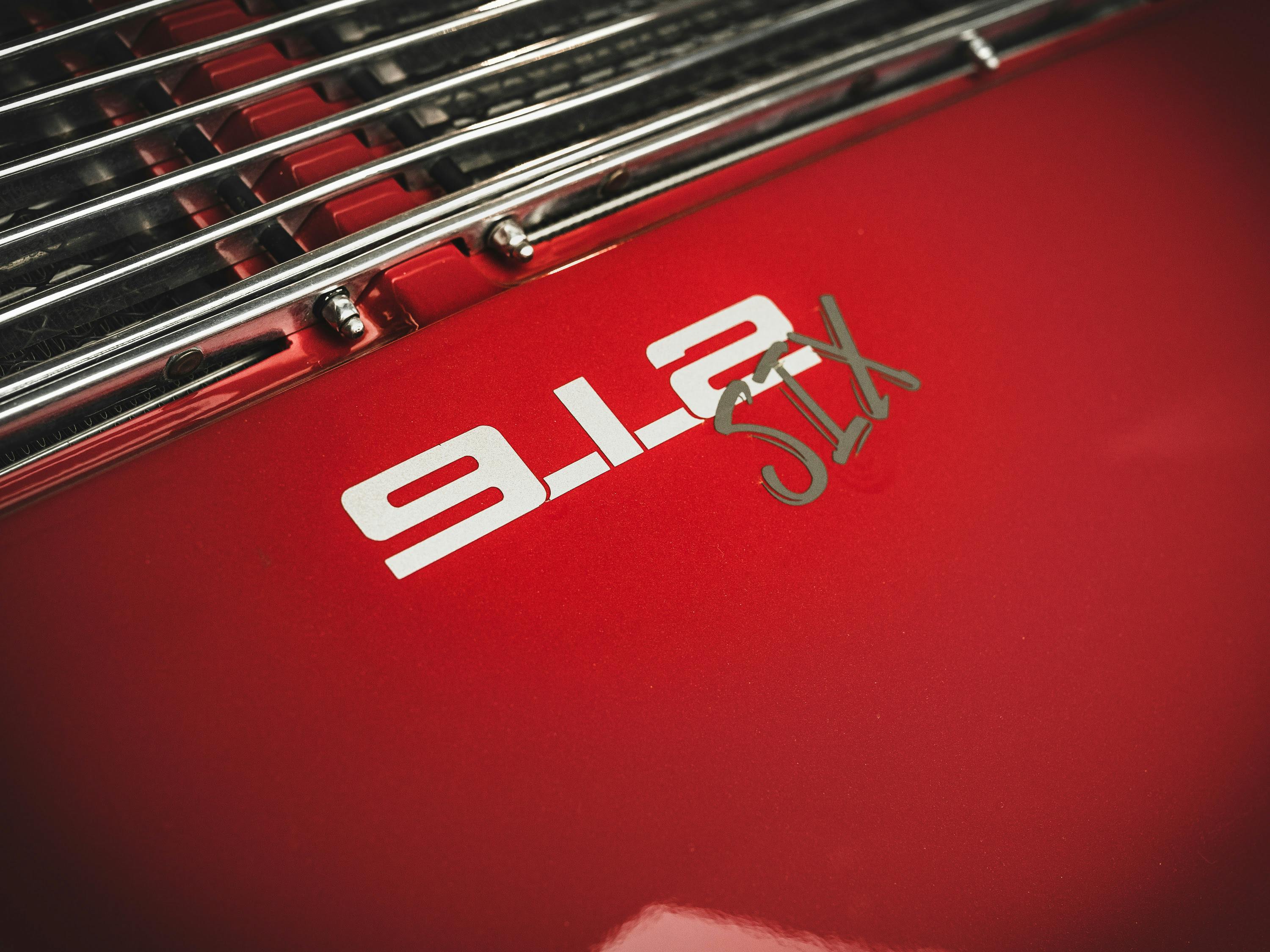 Red 912 with a flat six engine swap.