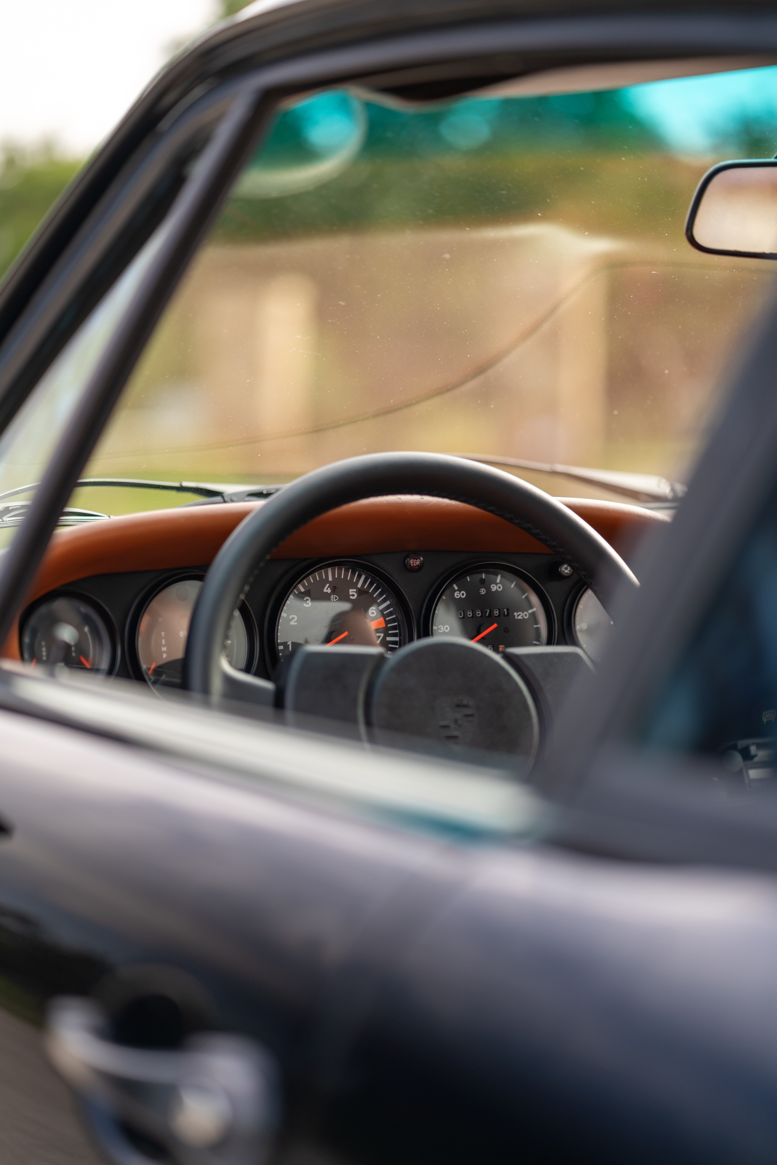 Interior of a 1976 Porsche 911S Sportomatic in Black on Cinnamon.