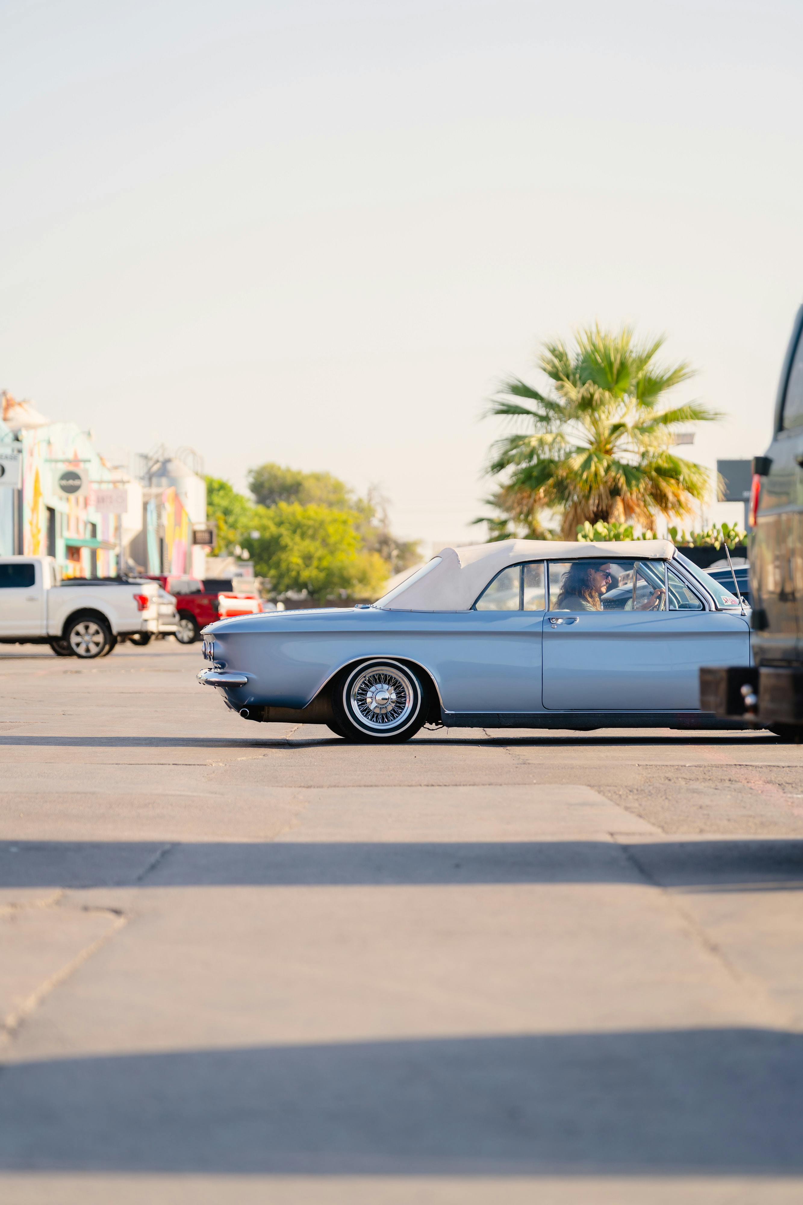 1966 Chevrolet Corvair Convertible in Blue with white interior shot in Austin, TX near St. Elmo.