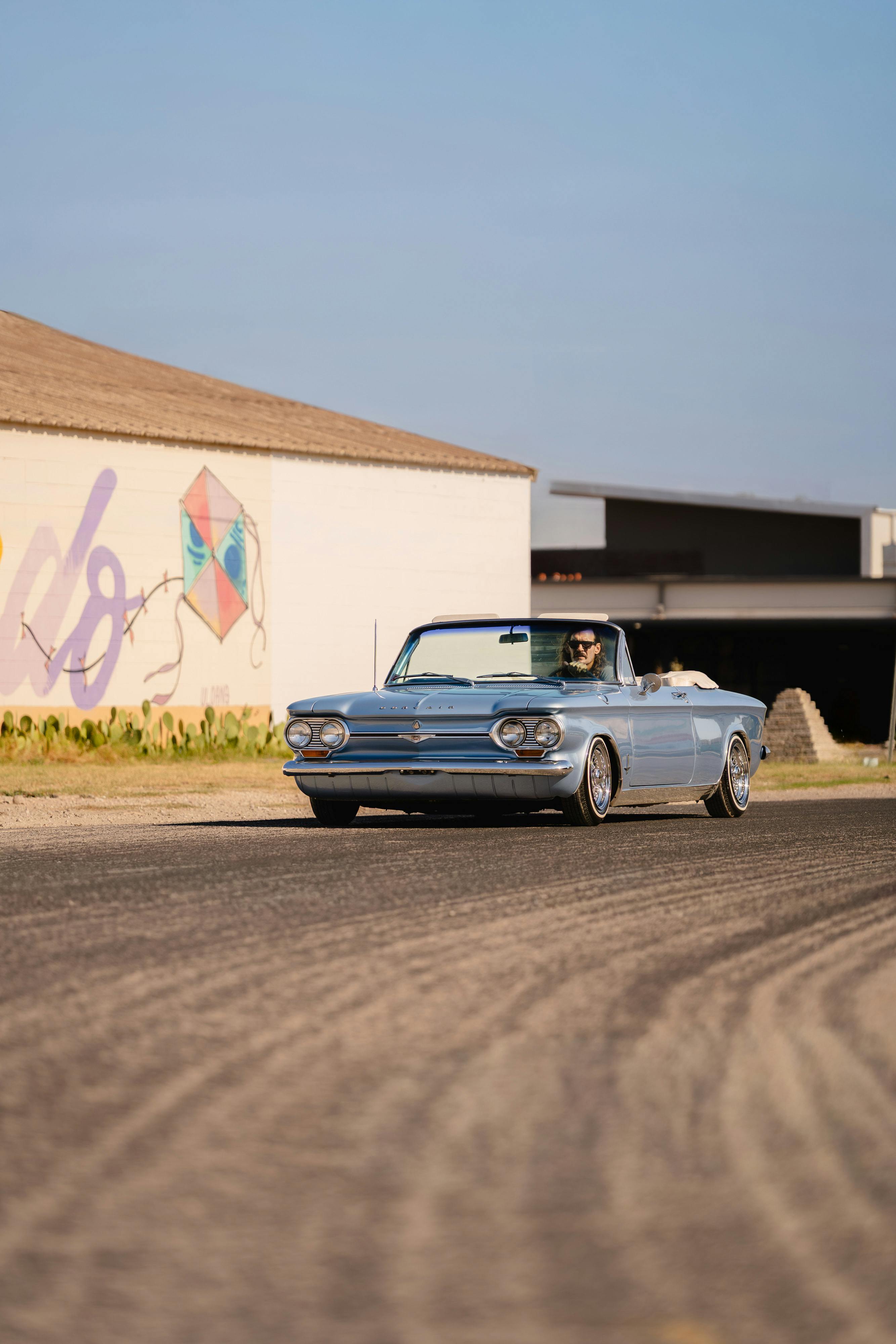 1966 Chevrolet Corvair Convertible in Blue with white interior shot in Austin, TX near St. Elmo.