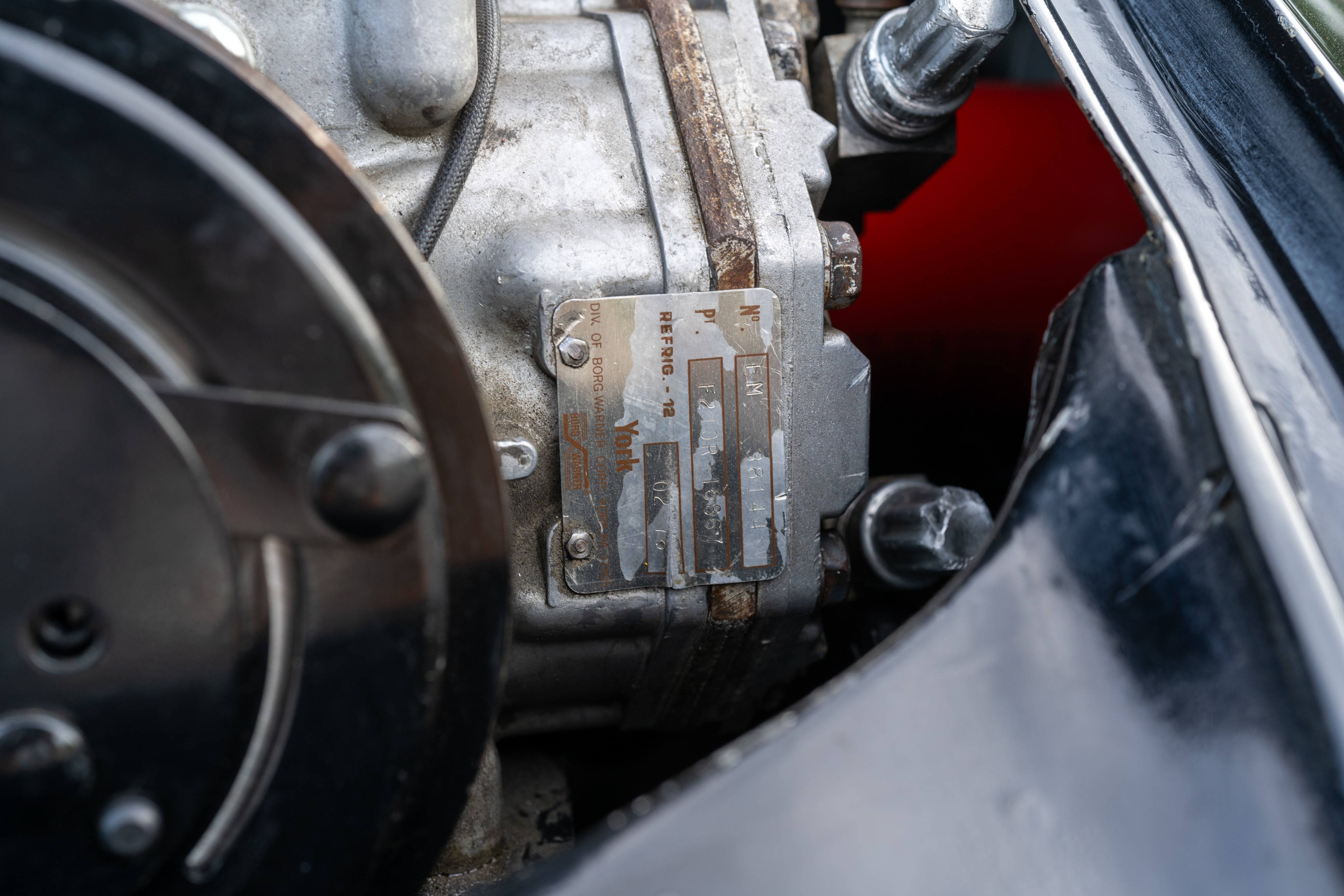 Engine bay of a 1976 Porsche 911S Sportomatic in Black on Cinnamon.