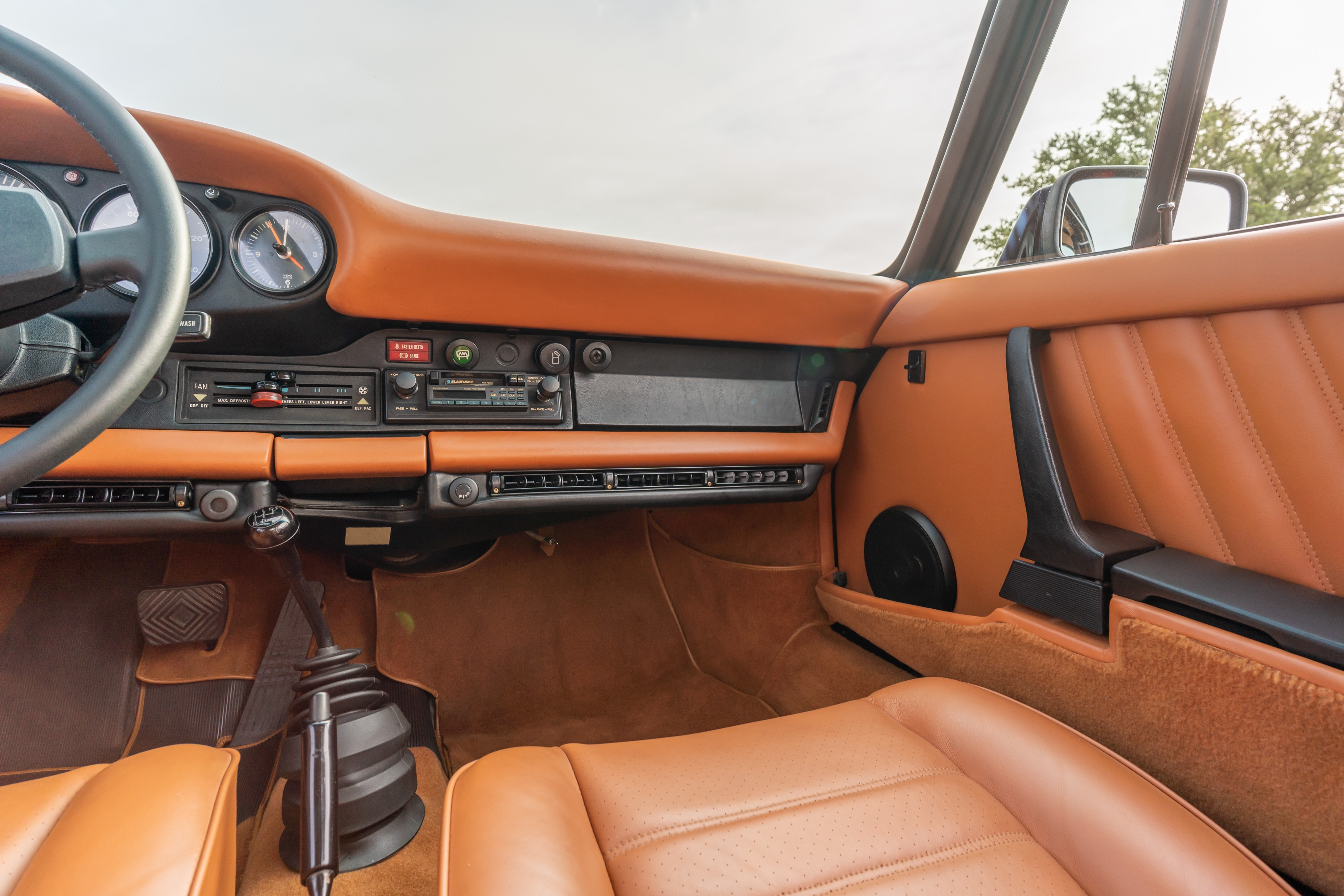 Interior of a 1976 Porsche 911S Sportomatic in Black on Cinnamon.