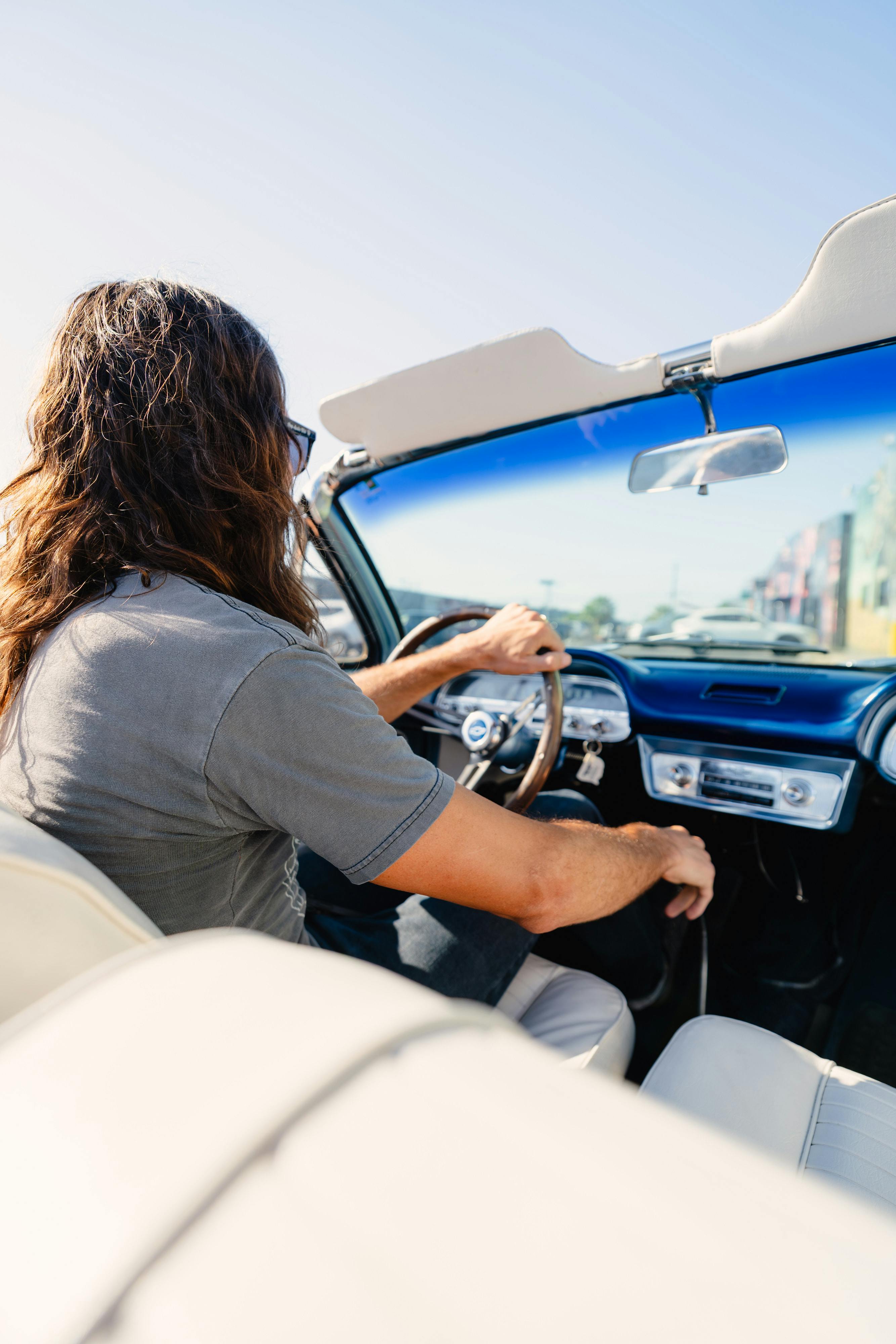 1966 Chevrolet Corvair Convertible in Blue with white interior shot in Austin, TX near St. Elmo.