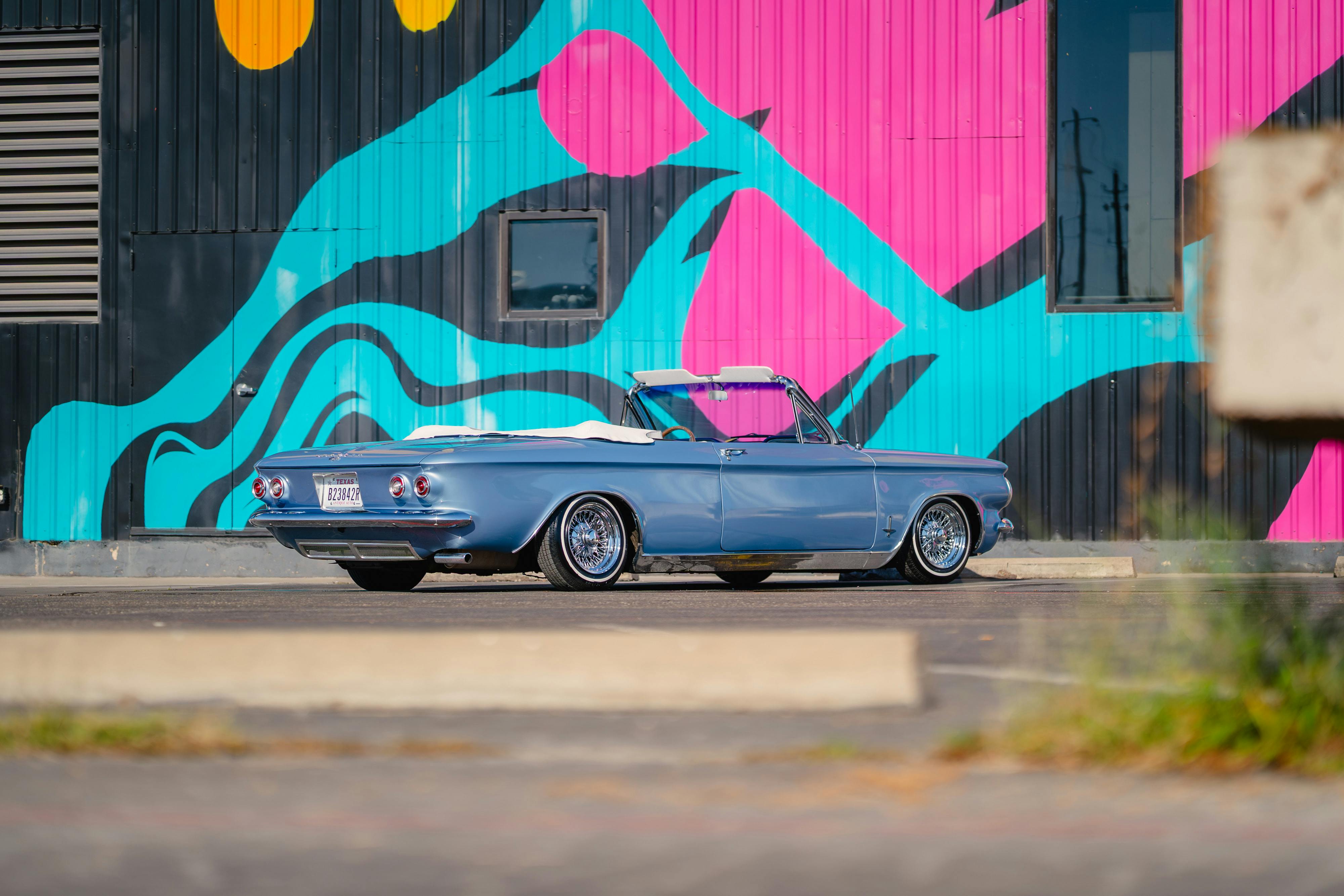 1966 Chevrolet Corvair Convertible in Blue with white interior shot in Austin, TX near St. Elmo.