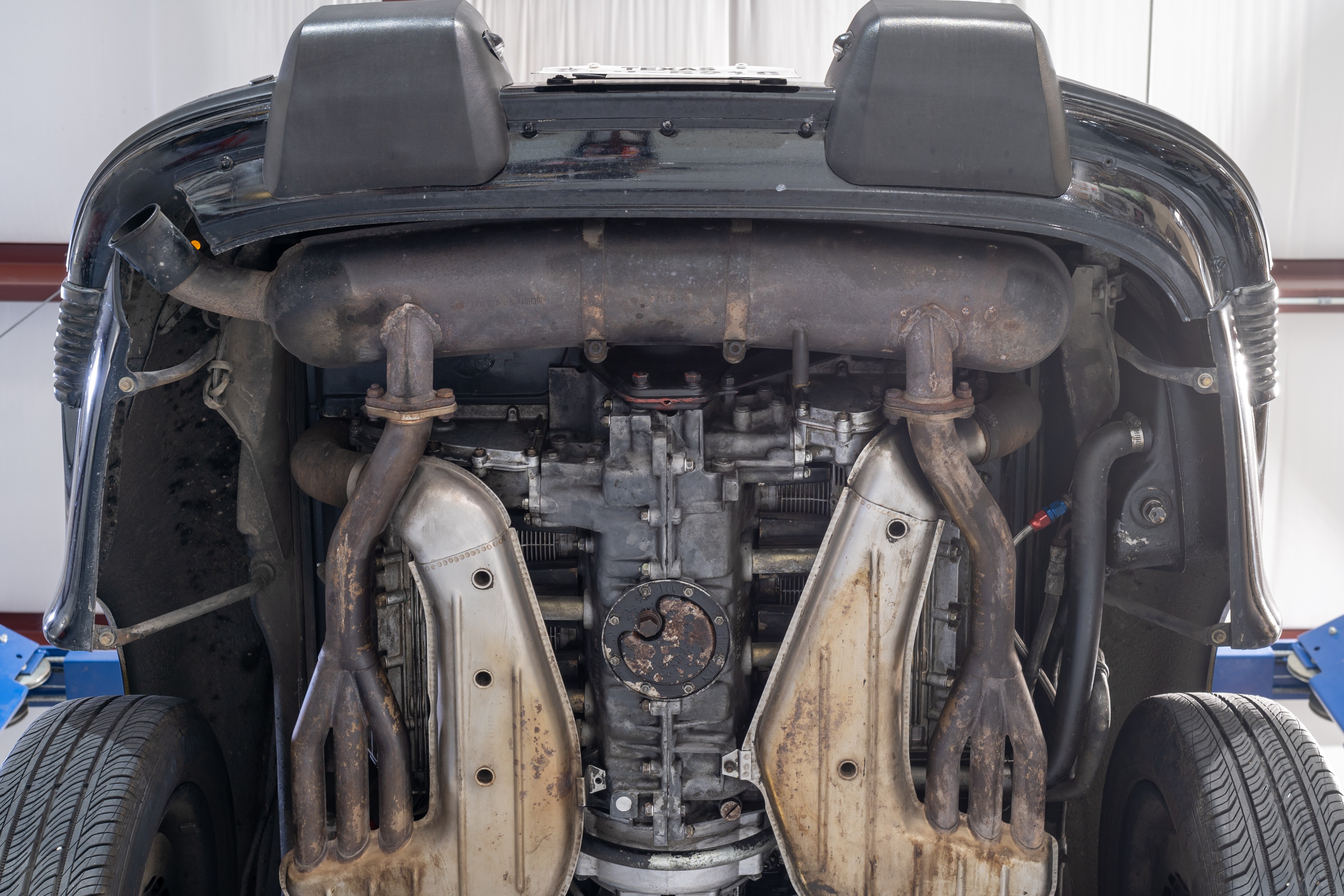 Undercarriage shots of a 1976 Porsche 911S Sportomatic in Black on Cinnamon.