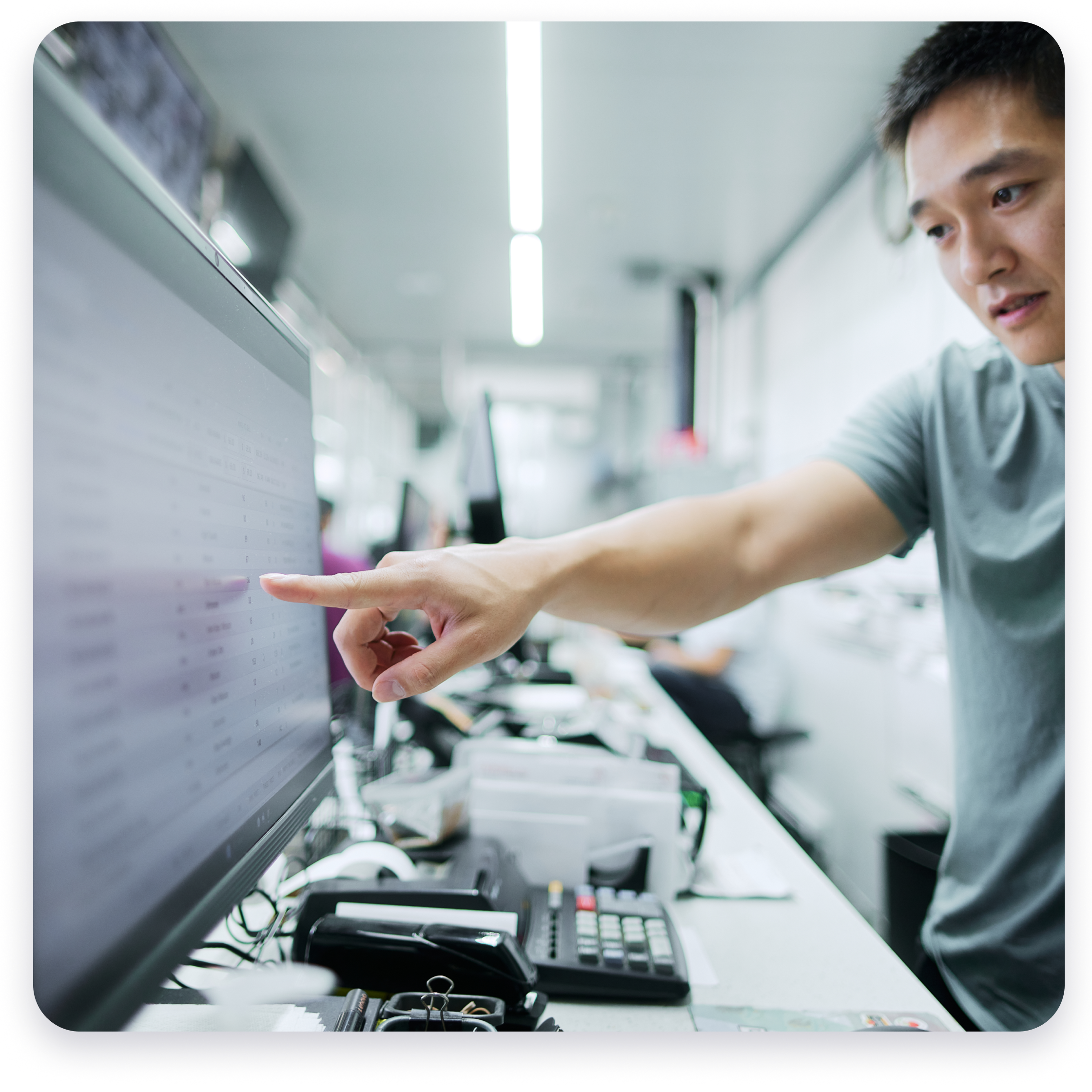 Silo user pointing to computer screen.