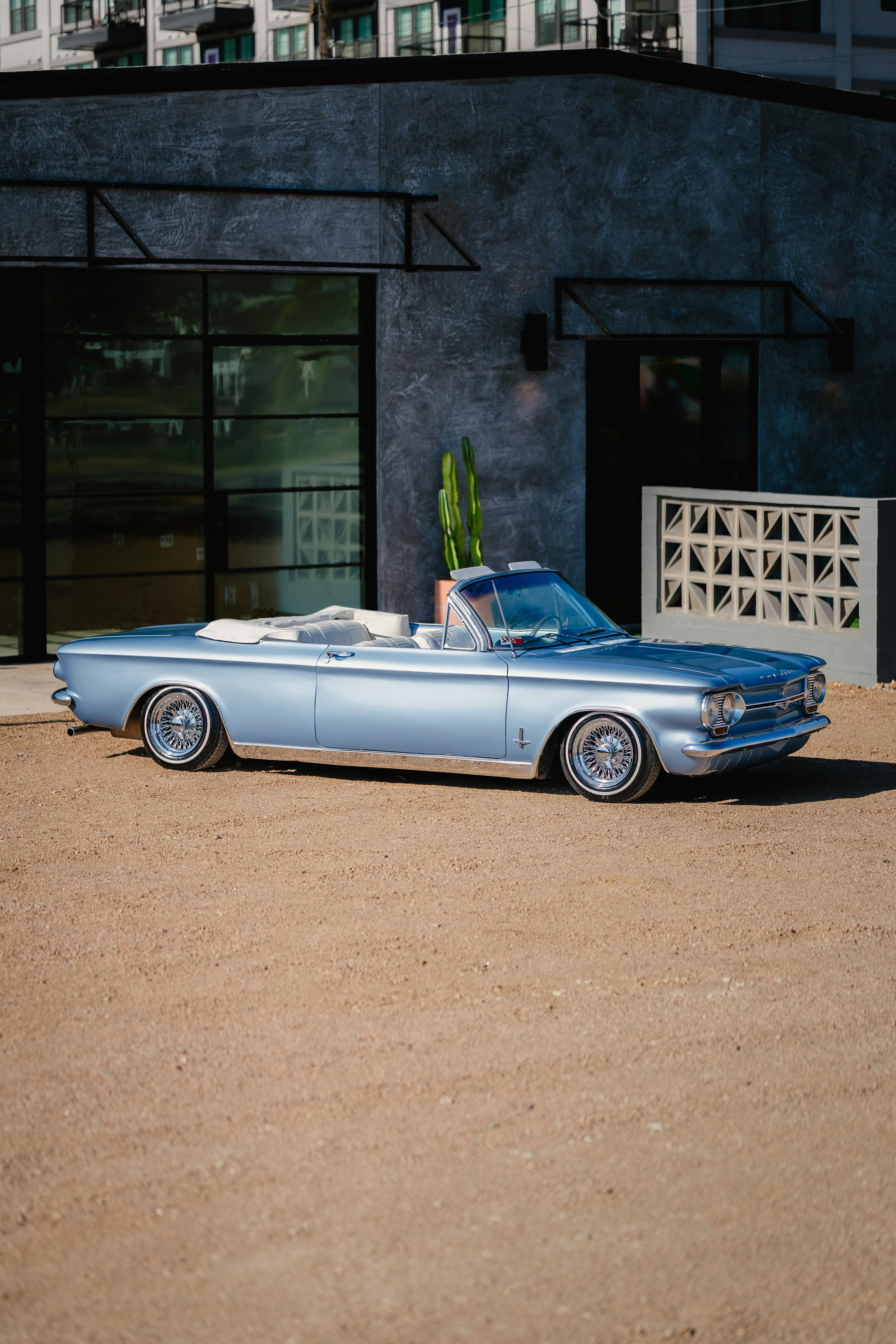 1966 Chevrolet Corvair Convertible in Blue with white interior shot in Austin, TX near St. Elmo.