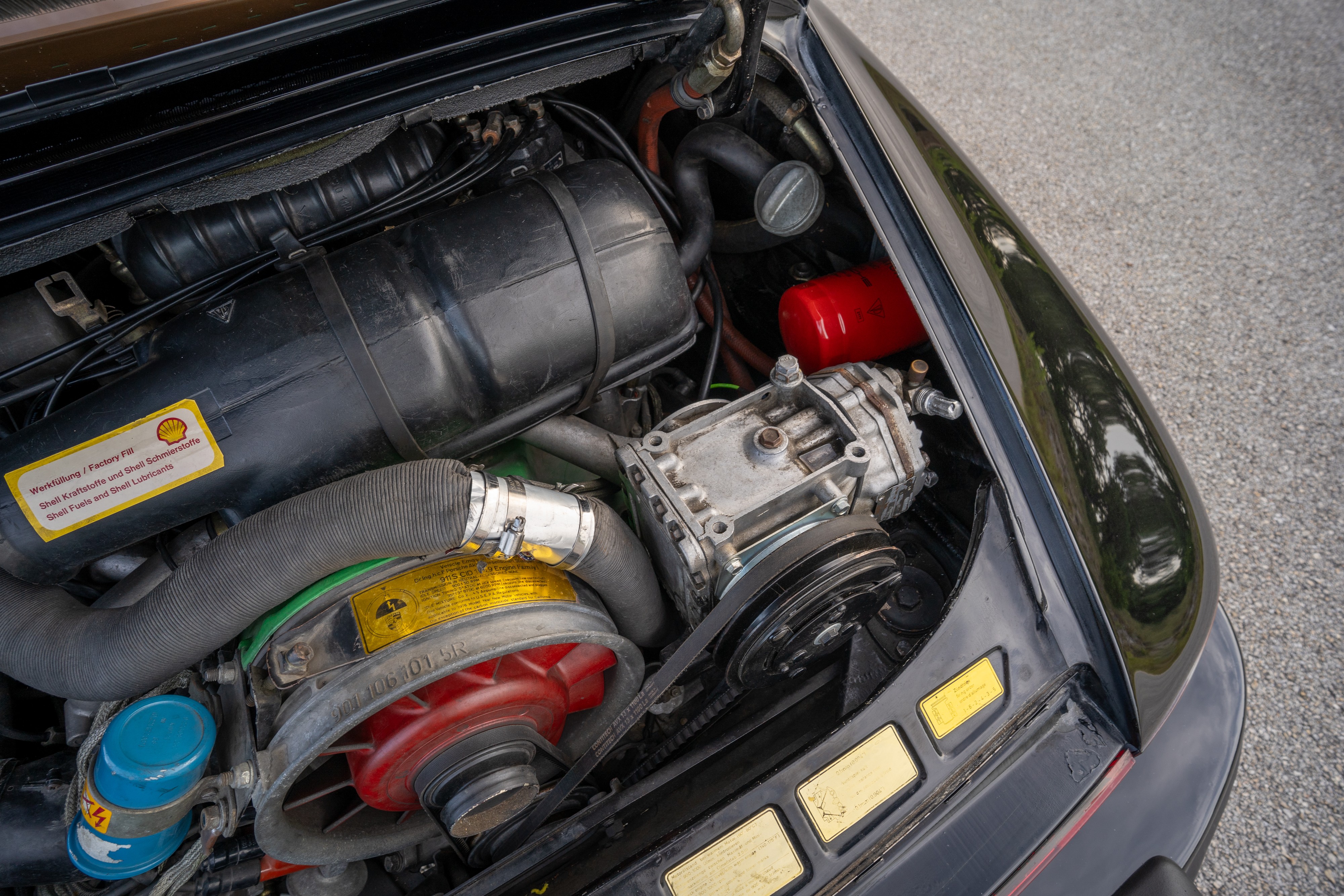 Engine bay of a 1976 Porsche 911S Sportomatic in Black on Cinnamon.