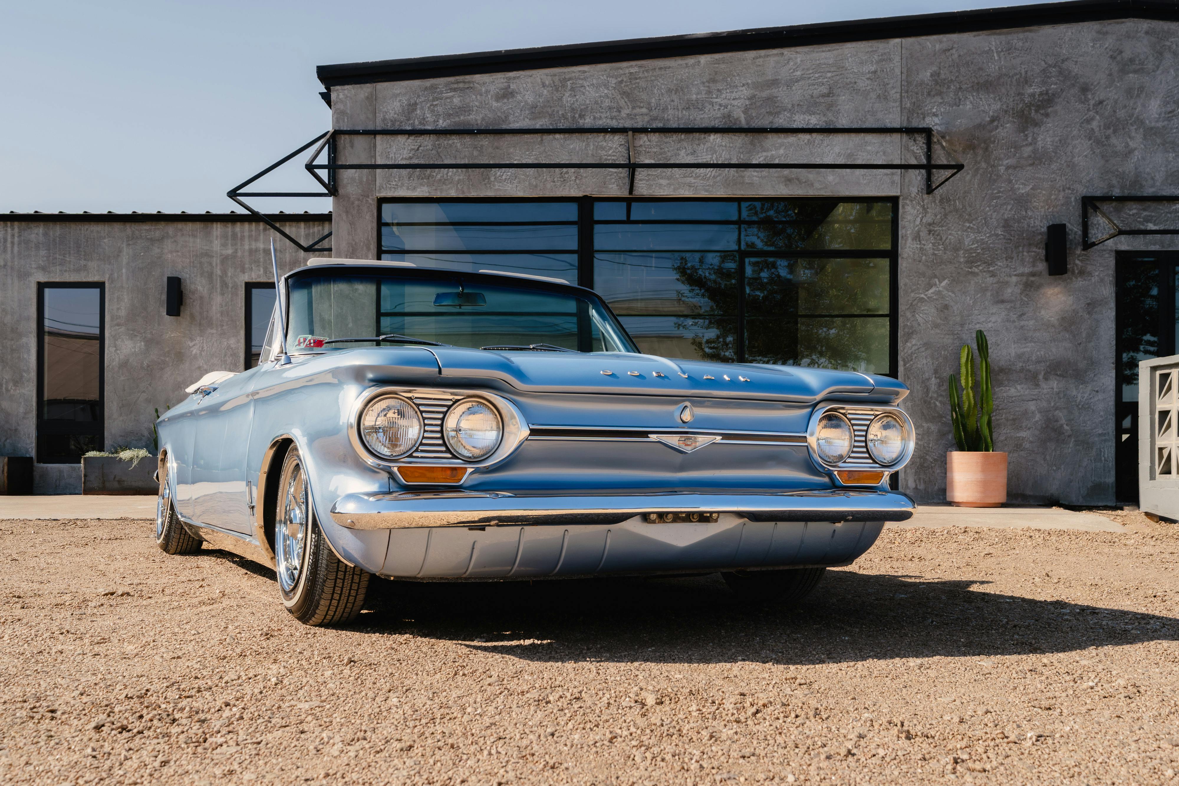 1966 Chevrolet Corvair Convertible in Blue with white interior shot in Austin, TX near St. Elmo.