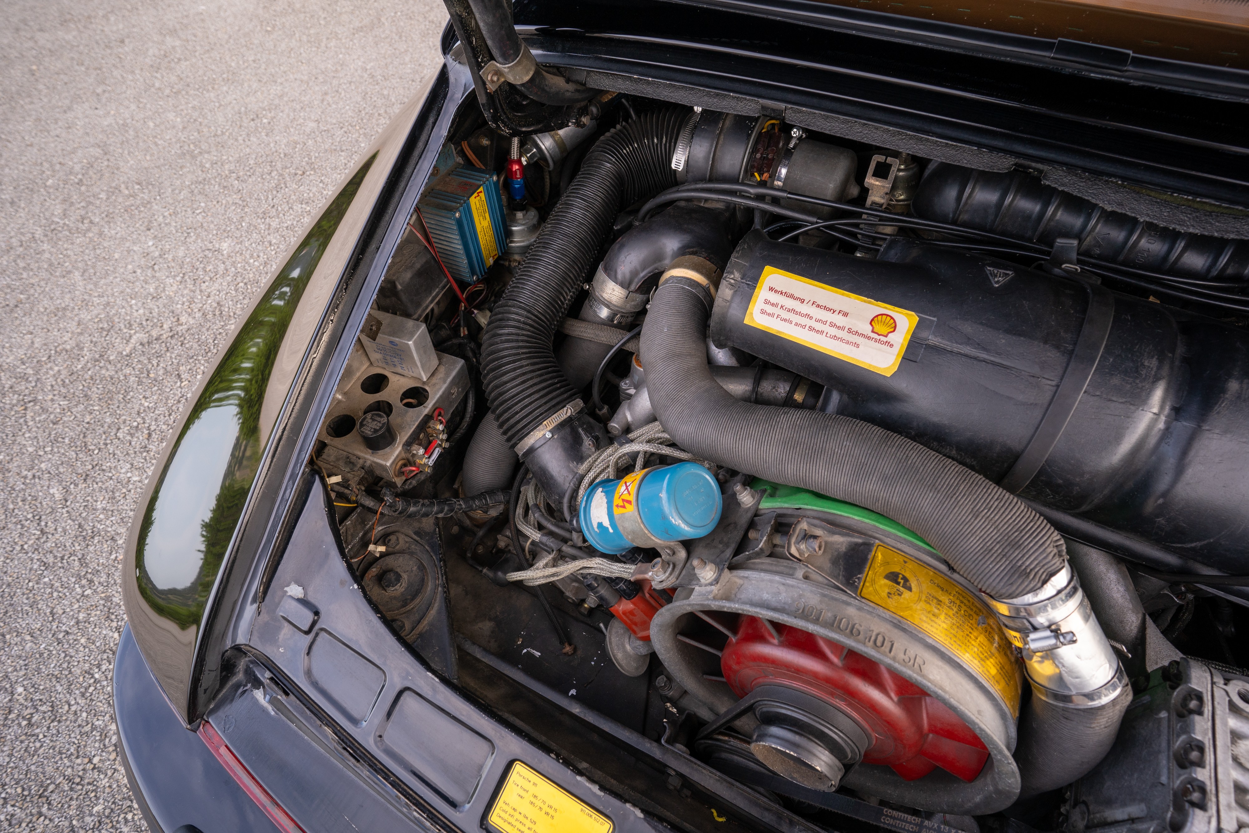 Engine bay of a 1976 Porsche 911S Sportomatic in Black on Cinnamon.