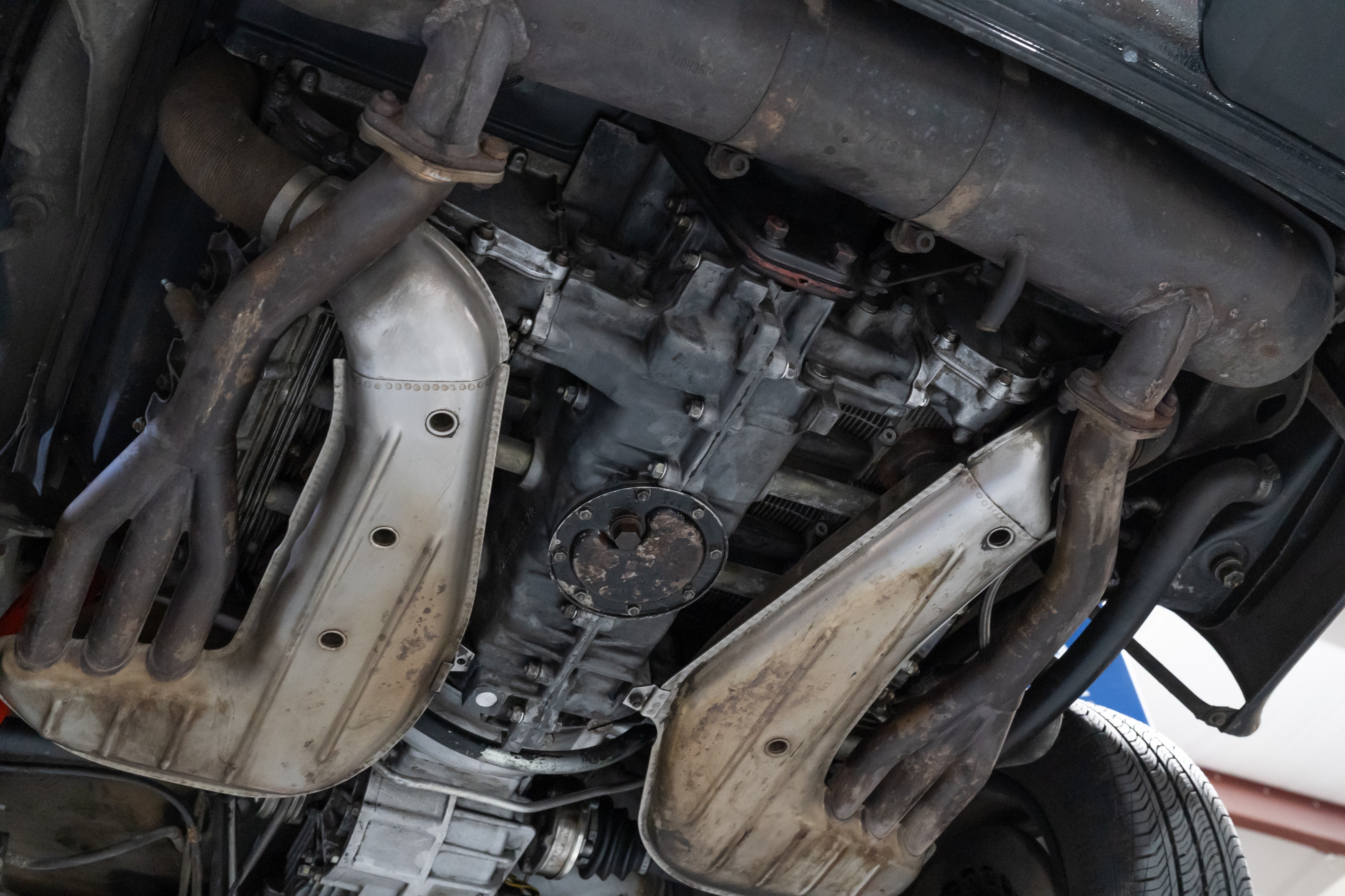 Undercarriage shots of a 1976 Porsche 911S Sportomatic in Black on Cinnamon.