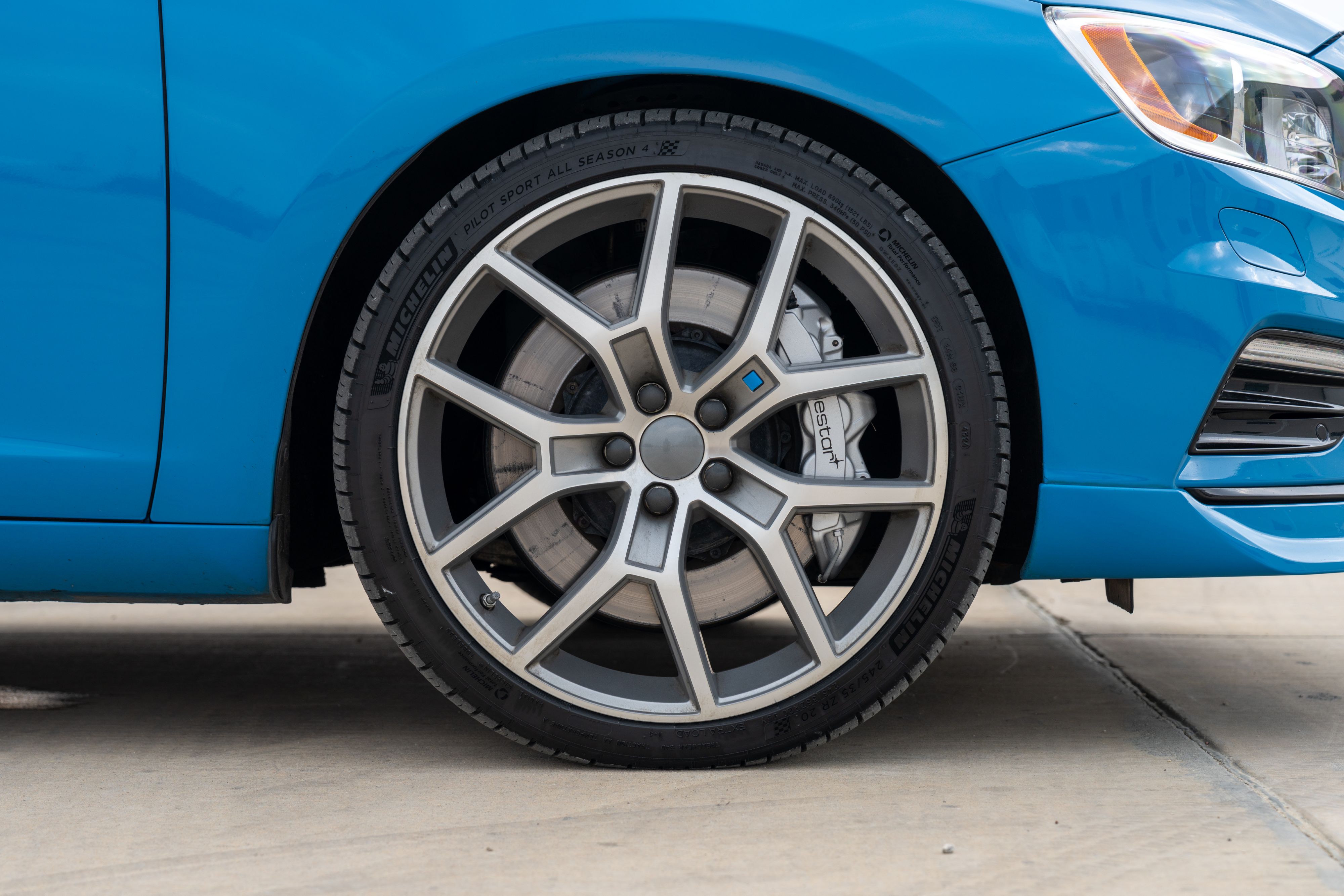 2015 Volvo V60 Polestar wheel in Rebel Blue with a Black interior.