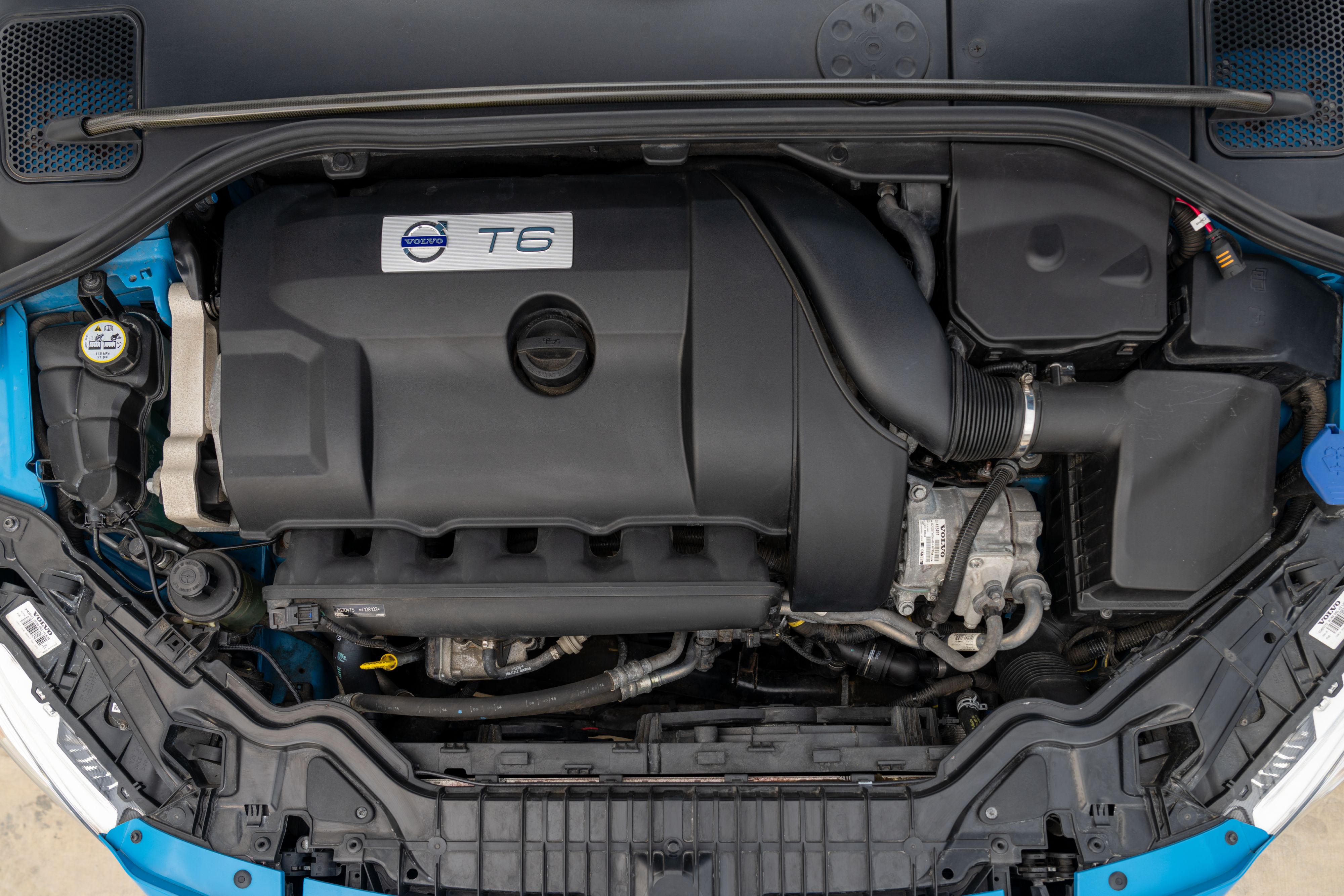 2015 Volvo V60 Polestar engine in Rebel Blue with a Black interior.