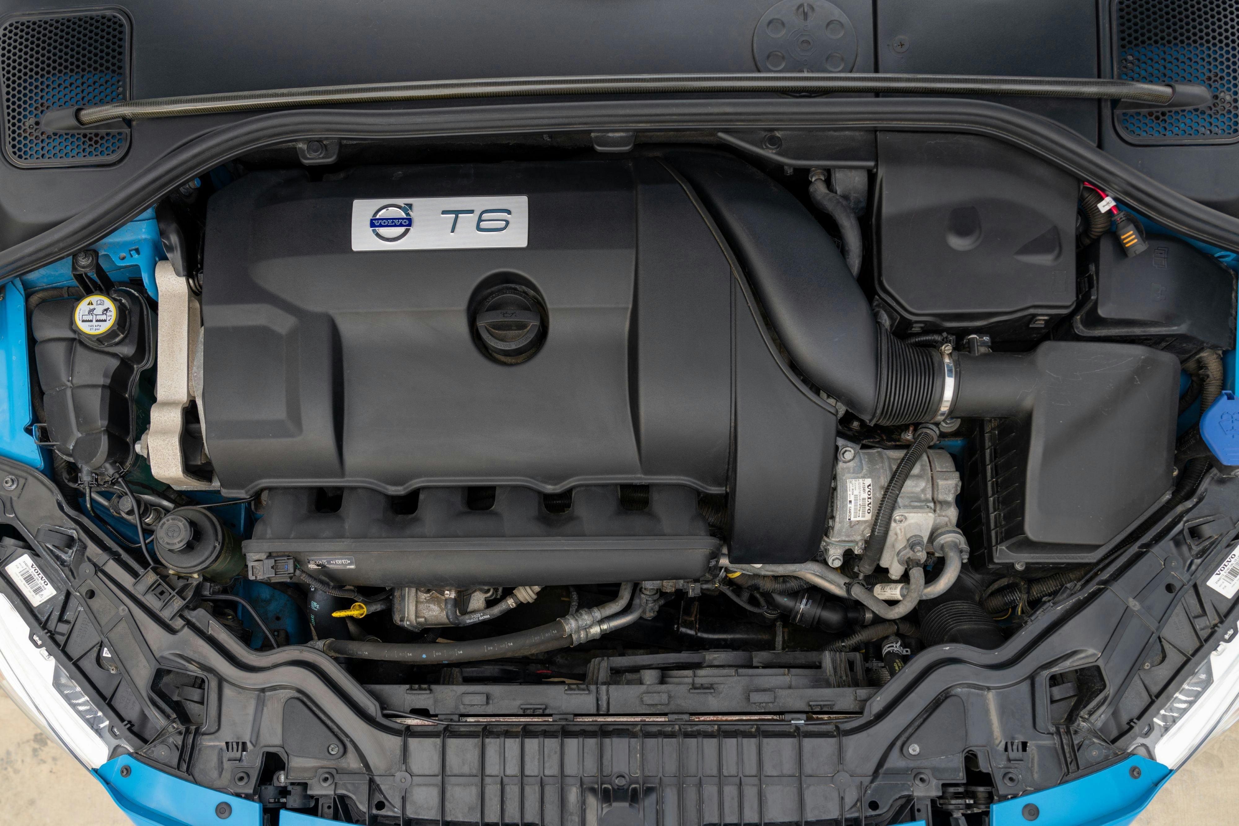 2015 Volvo V60 Polestar engine in Rebel Blue with a Black interior.