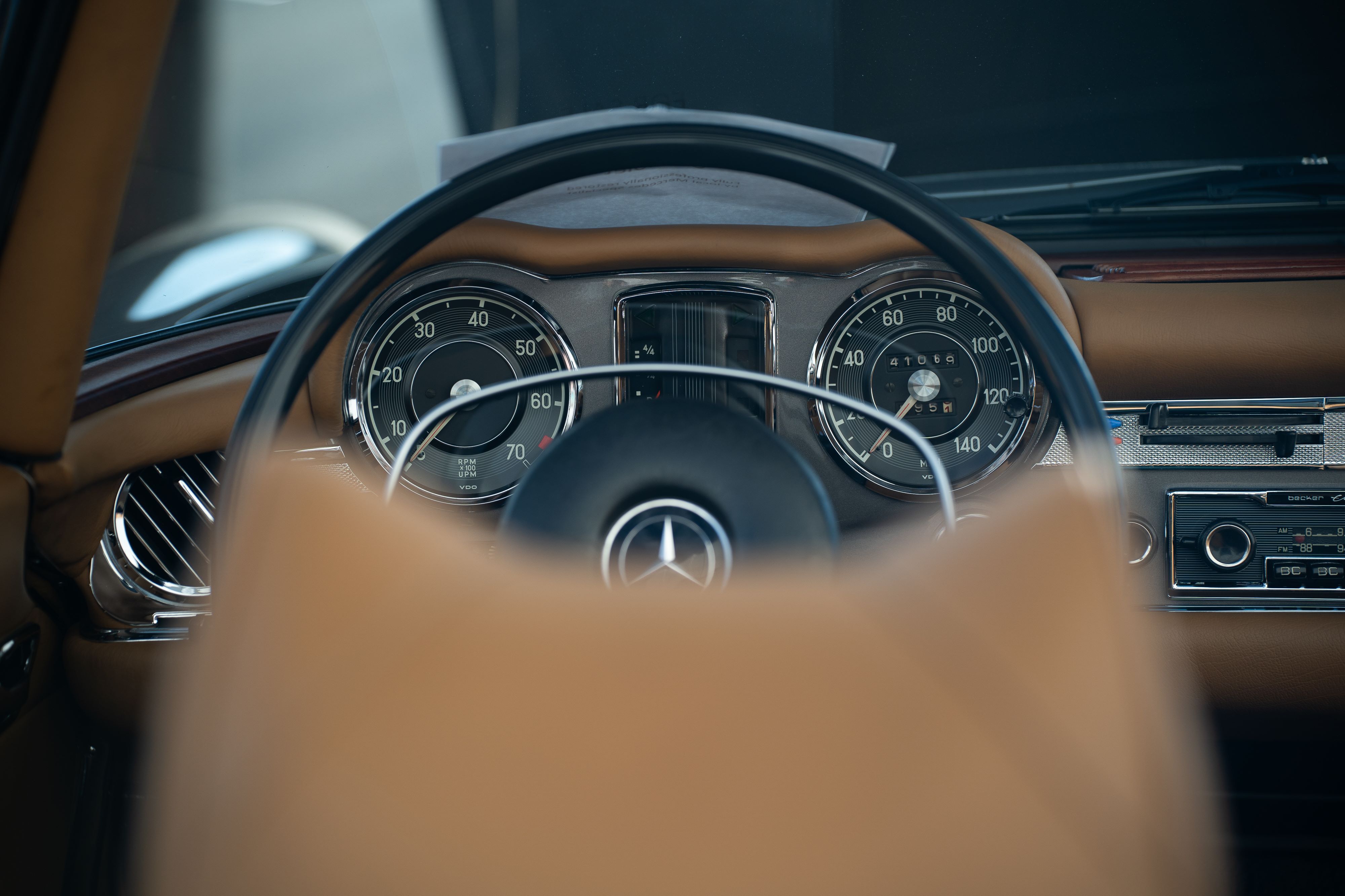 Gauge cluster and steering wheel of a classic Mercedes.