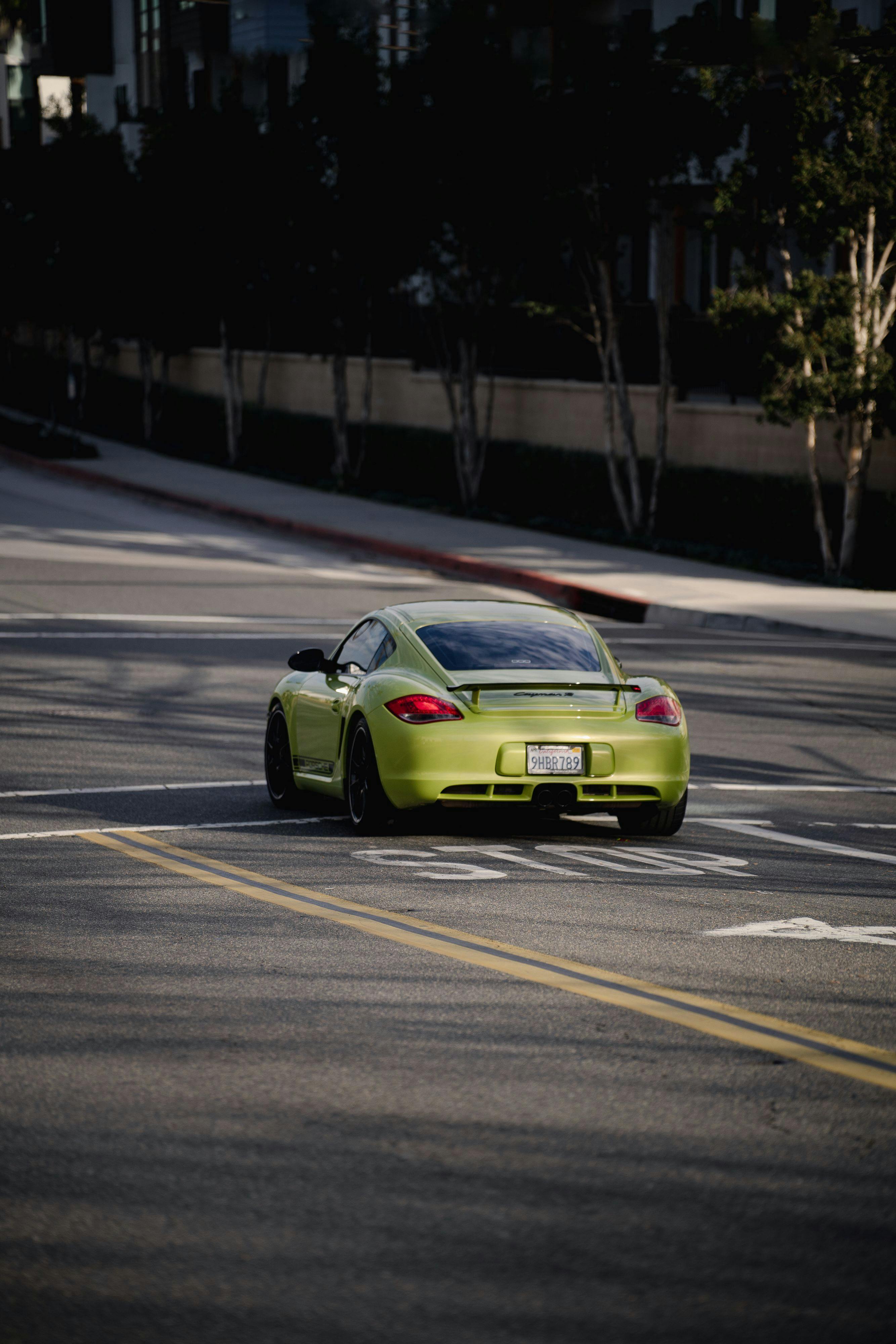Porsche Cayman R in Peridot Green outside of Car Parc.