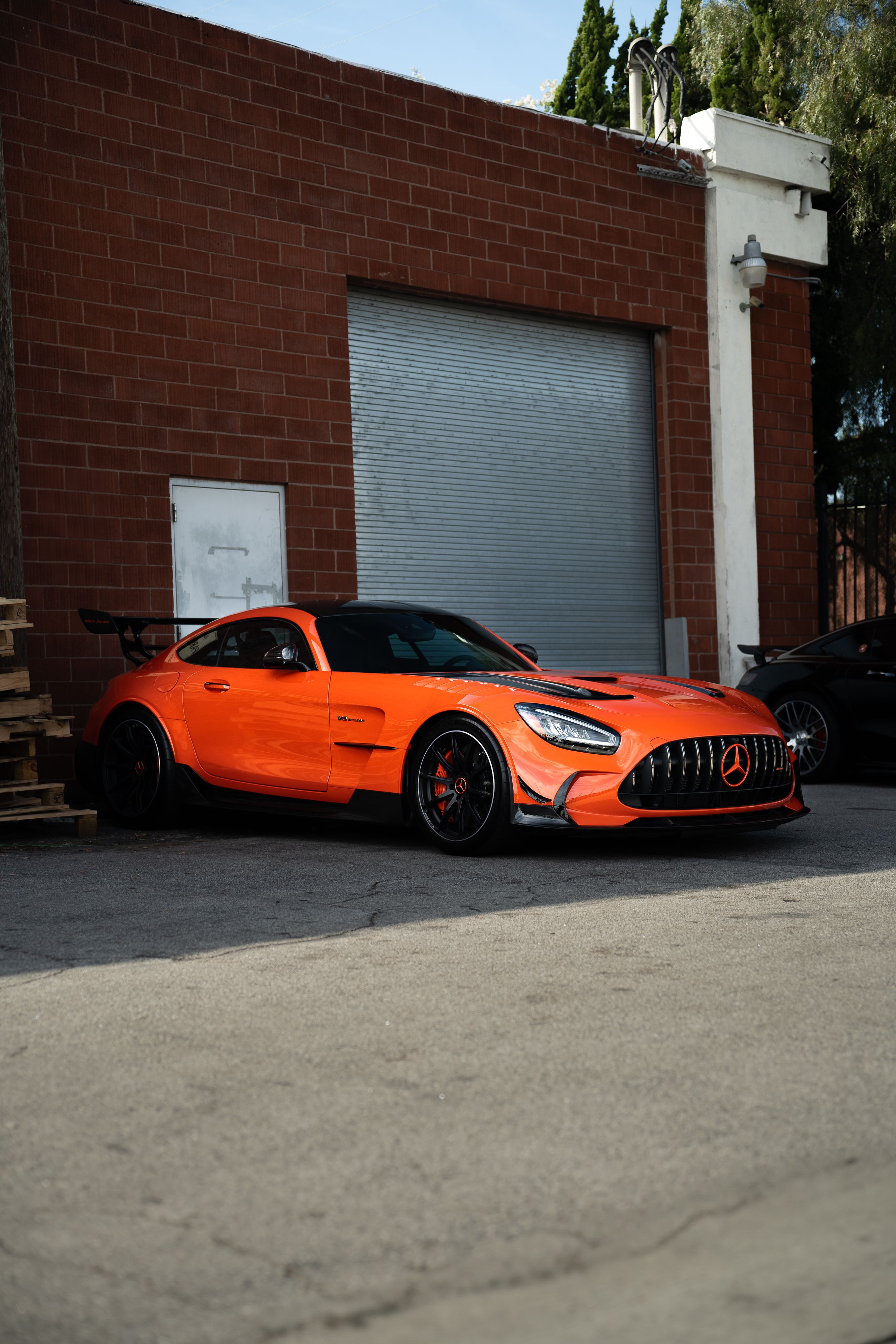 AMG GT Black Series in Magma Beam Orange outside of Pelican Parts.