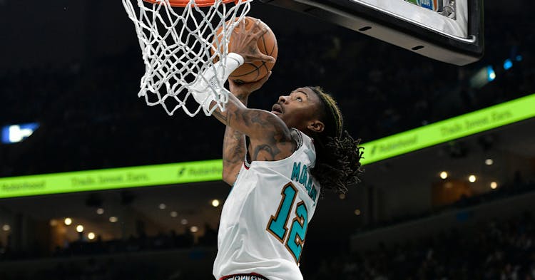Ja Morant finishing at the basket.