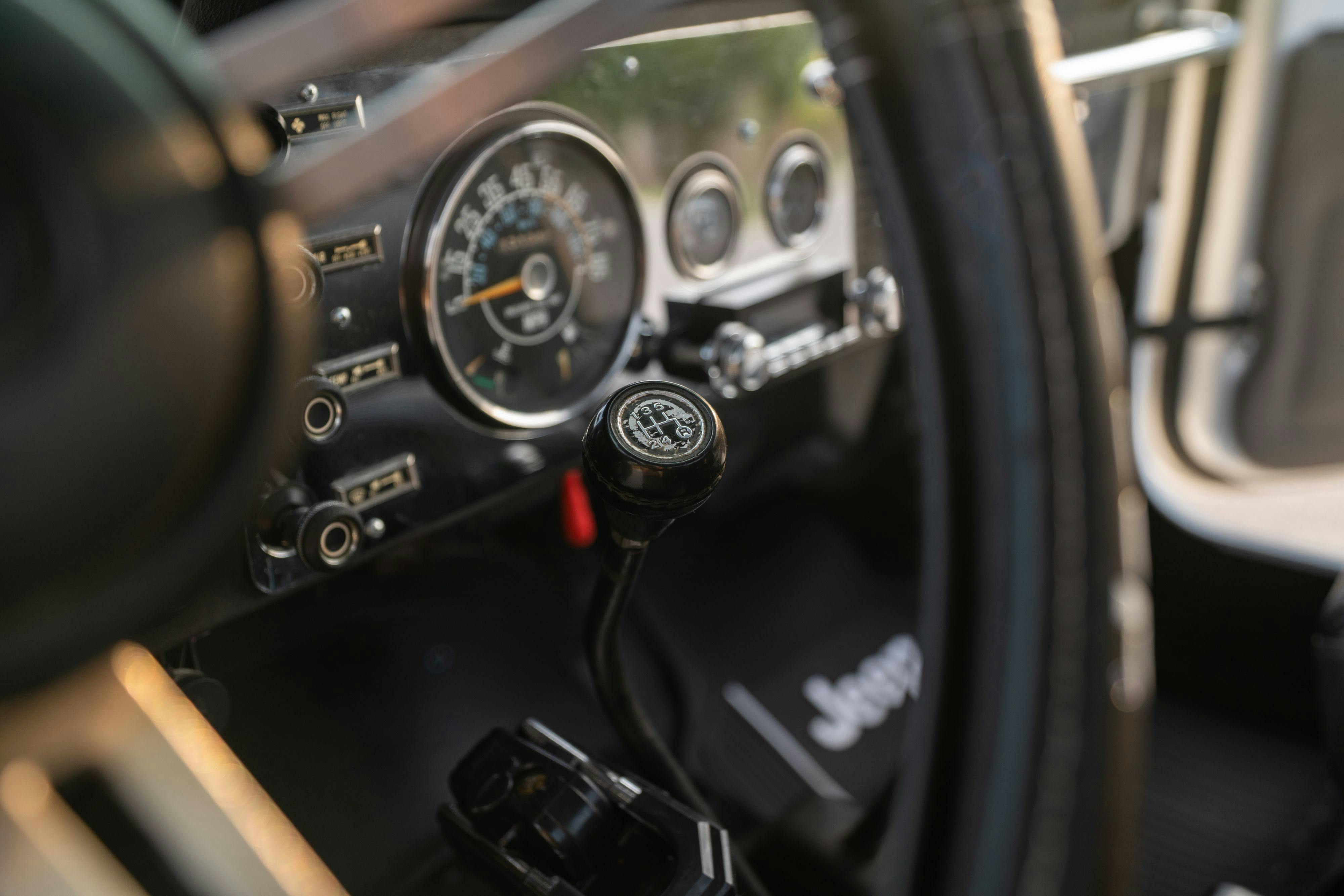 The interior of a 1983 Jeep Scrambler in White on Black in Austin, TX.