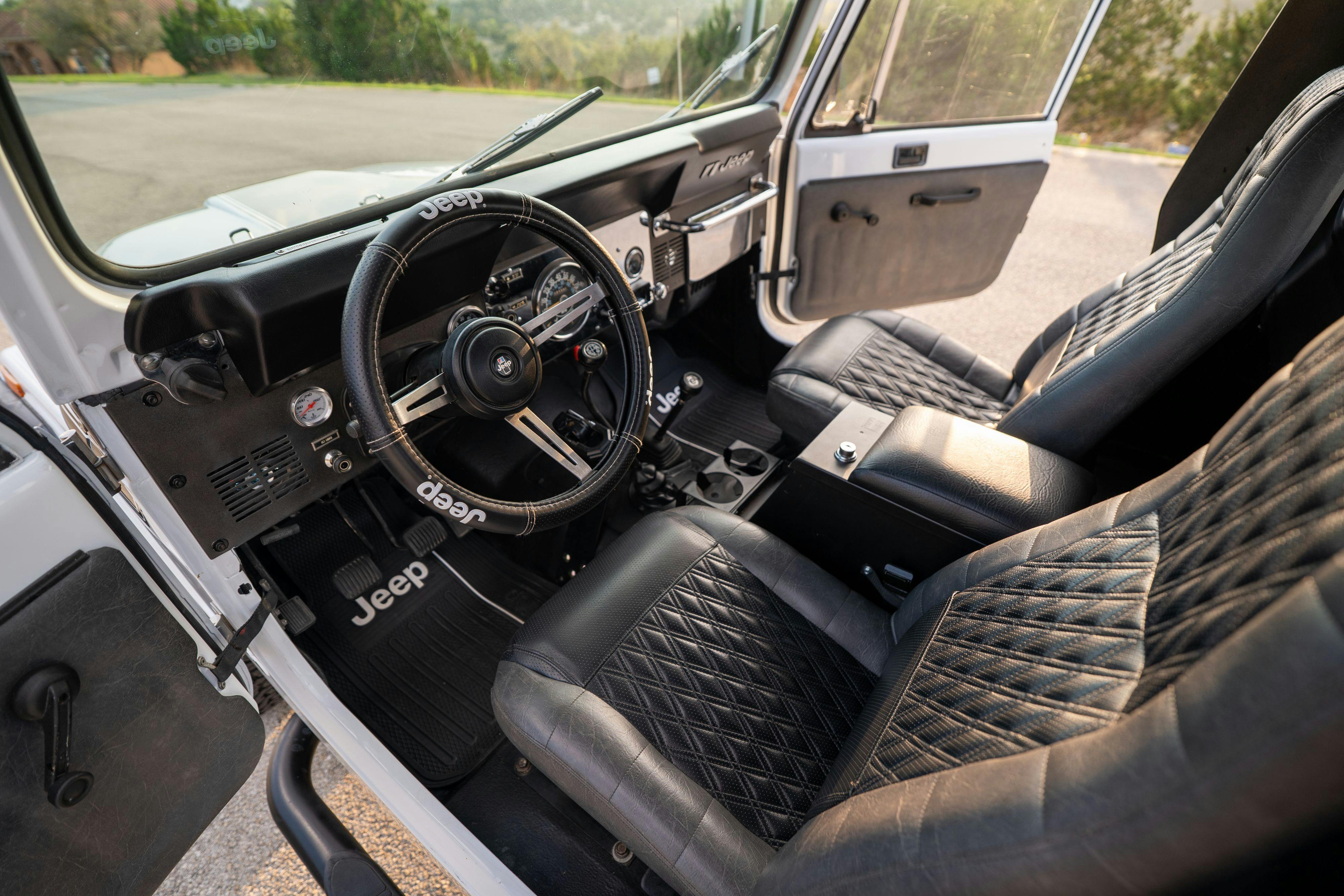 The interior of a 1983 Jeep Scrambler in White on Black in Austin, TX.
