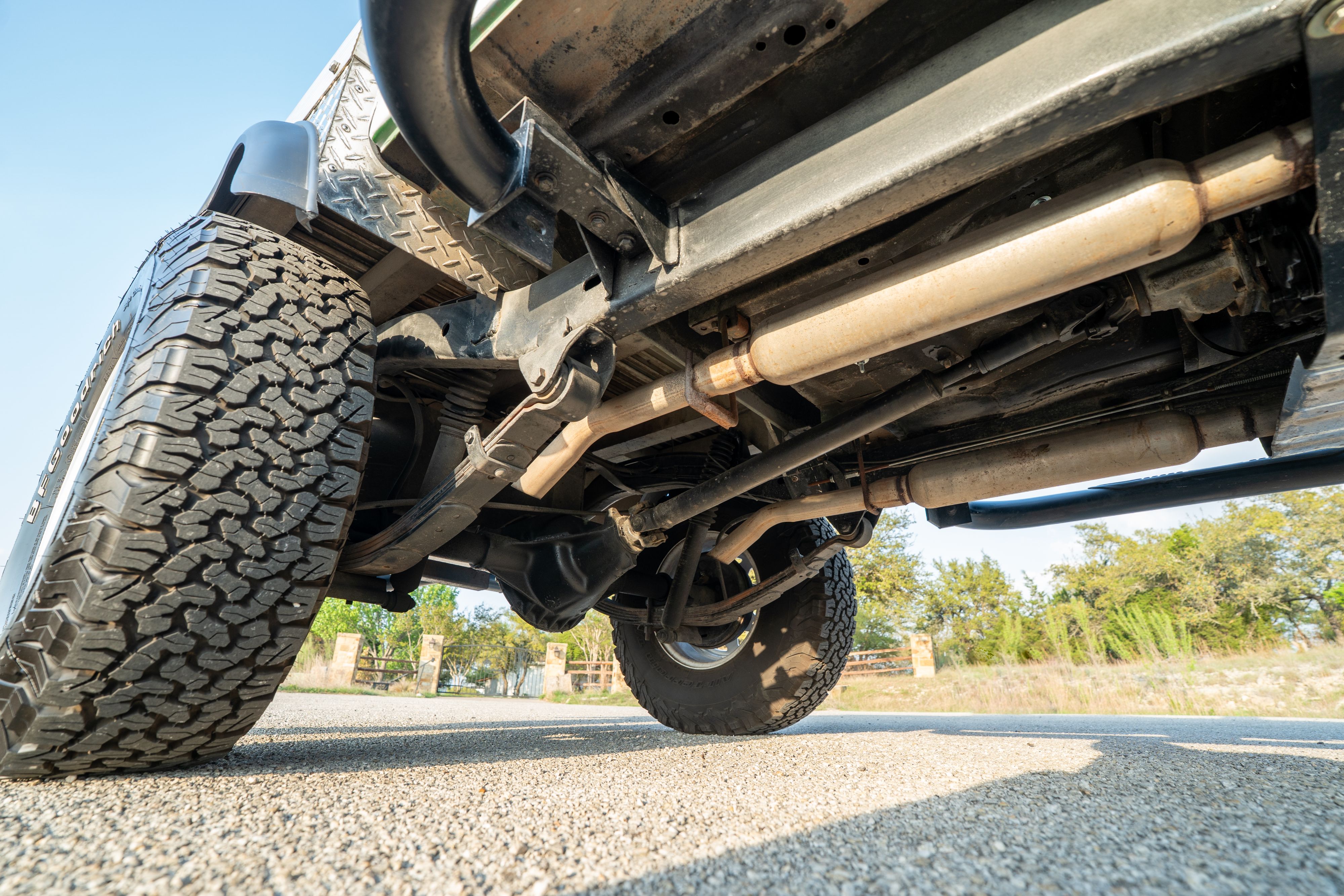 Underside of a 1983 Jeep Scrambler in White on Black in Austin, TX.
