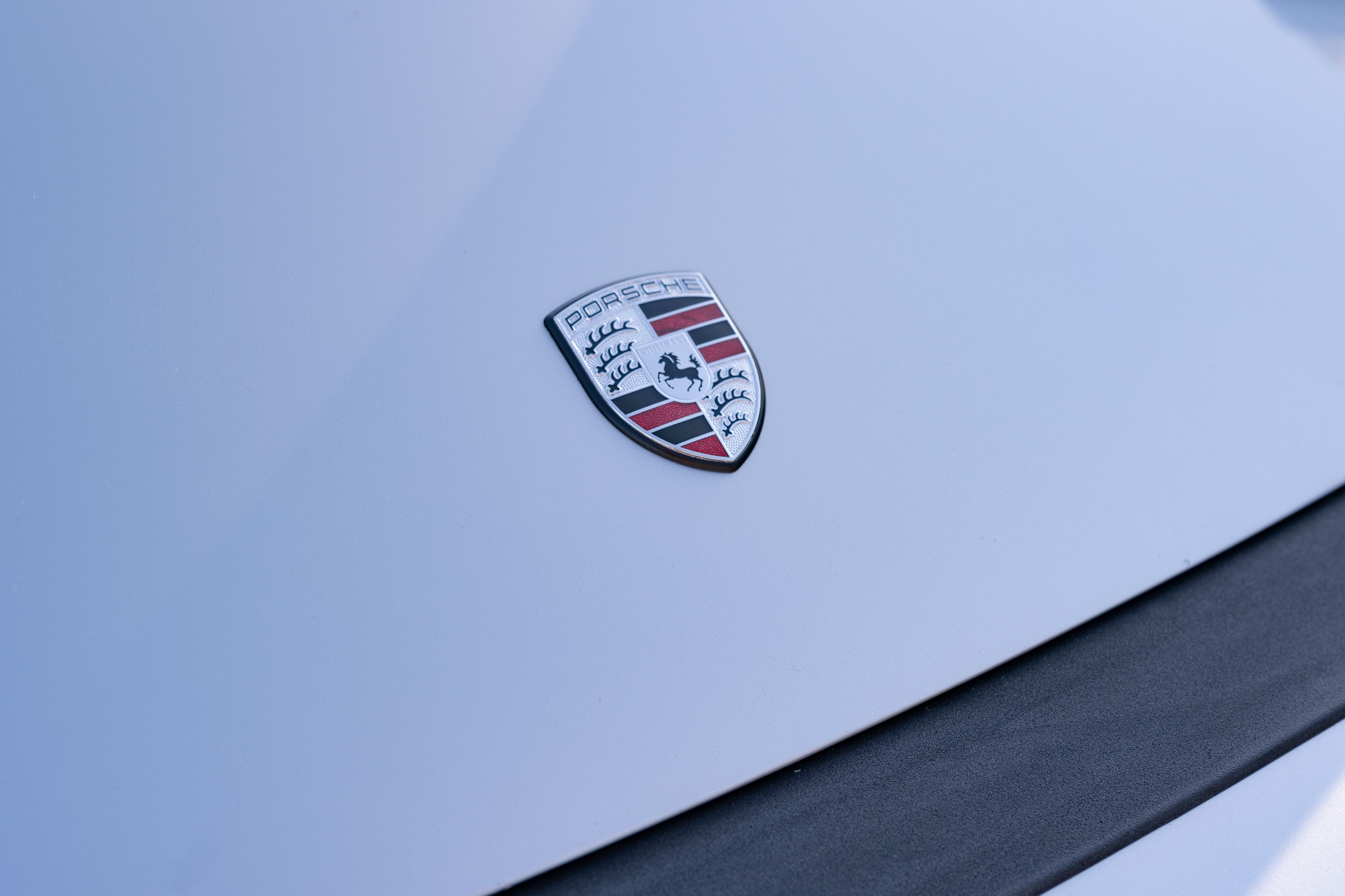 Porsche frunk badge on a 1987 Porsche 911 Carrera G50 Coupe in Silver Metallic in Dripping Springs, TX.