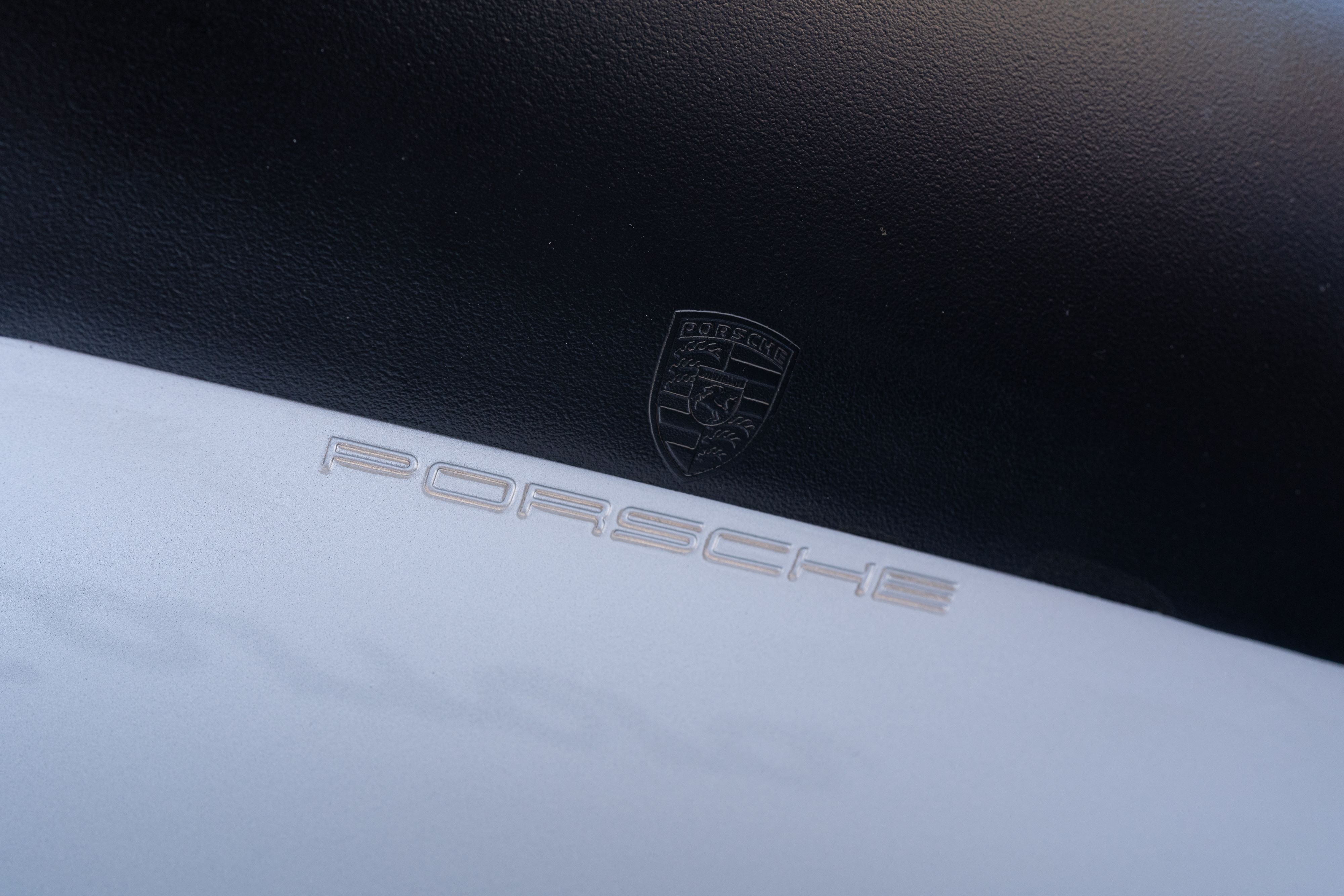 Stamping under the wing of a 1987 Porsche 911 Carrera G50 Coupe in Silver Metallic in Dripping Springs, TX.